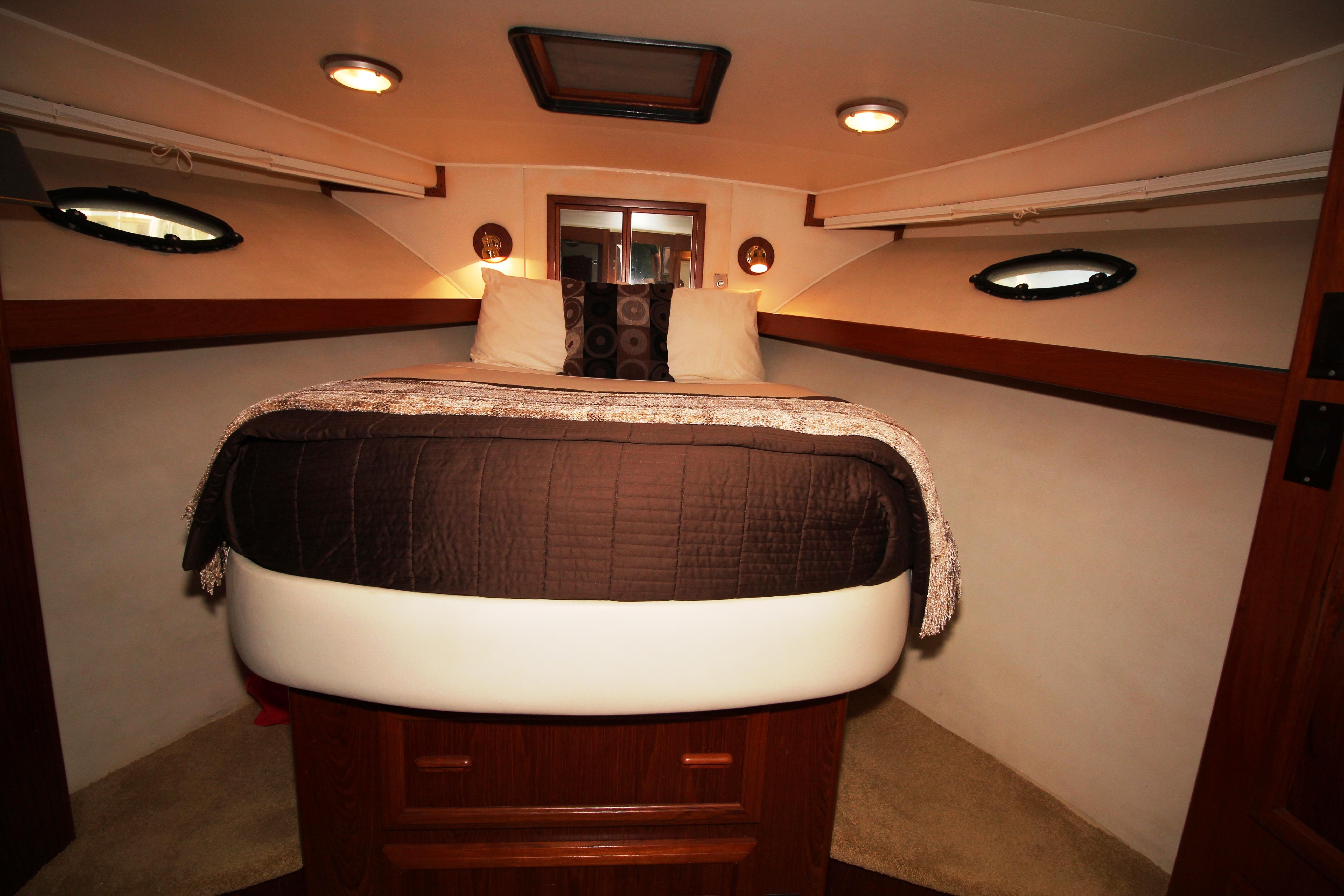 Forward Stateroom with queen size bed on centerline.