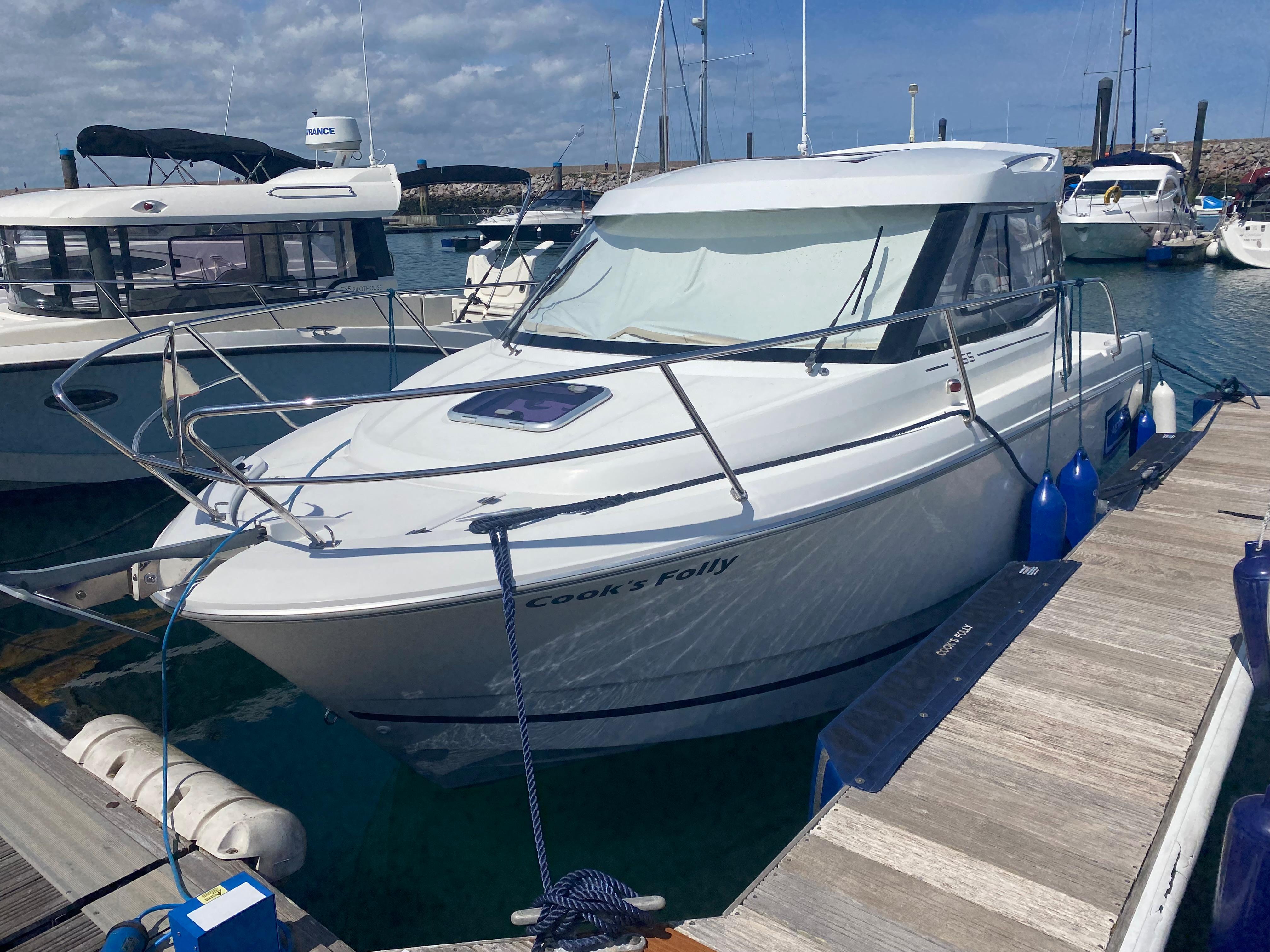 2014 Jeanneau Merry Fisher 755 docked at marina.