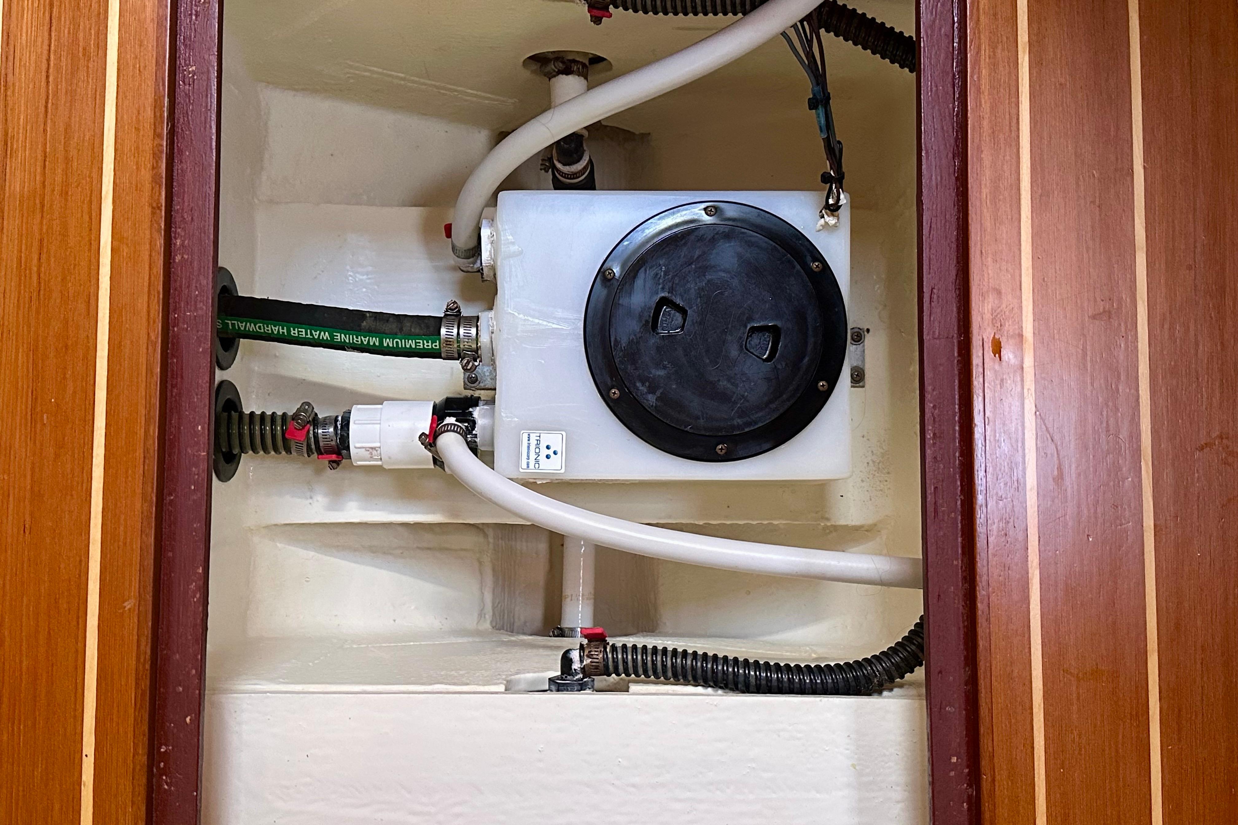 Bilge compartment of 2017 Sabre 42 Salon Express with plumbing and wiring.
