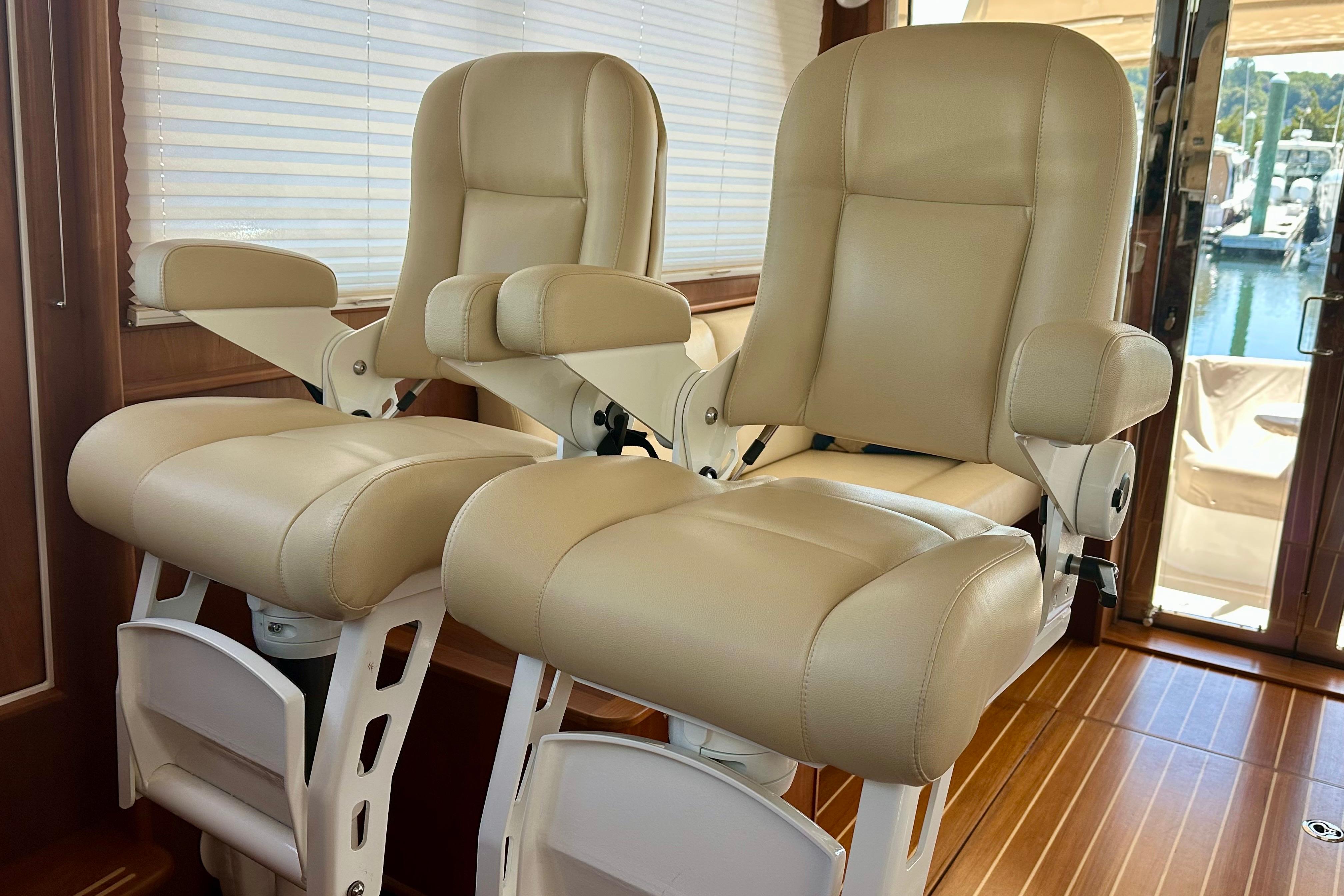 Luxurious beige captain chairs in 2017 Sabre 42 Salon Express yacht interior.