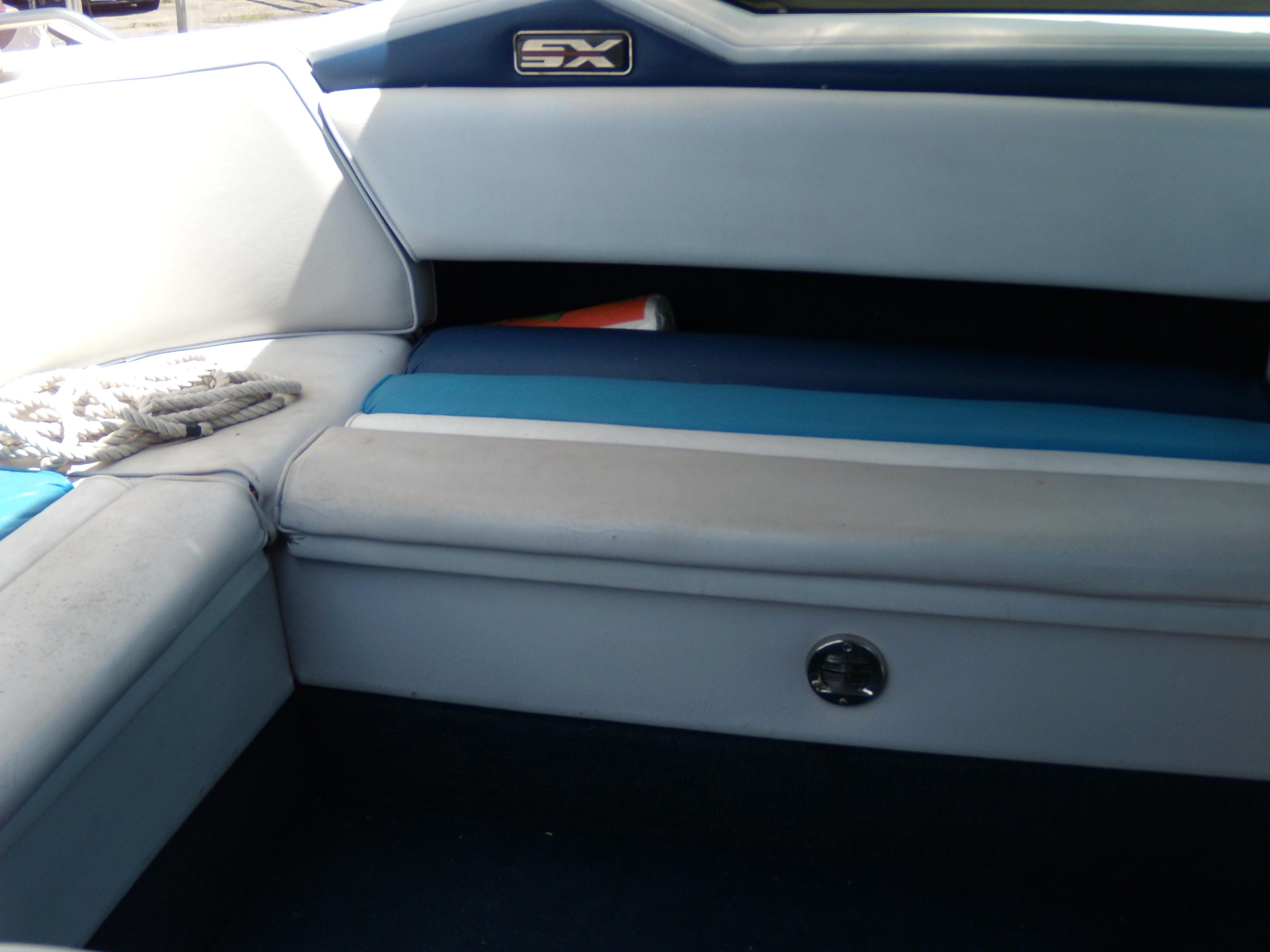 1989 Chaparral 2300 SX Sport boat interior with blue and white seating.