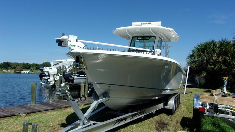 Crevalle-33 CSF Offshore Fishing 2022 -FL-US-2022 Crevalle 33 CSF Offshore Fishing boat on trailer by the water.-9541276 | Thumbnail