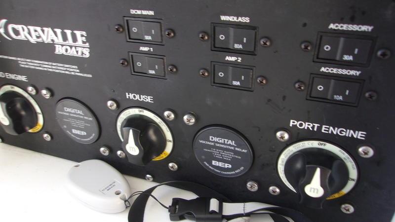 Crevalle-33 CSF Offshore Fishing 2022 -FL-US-Control panel of 2022 Crevalle 33 CSF Offshore Fishing boat with switches and dials.-9541276 | Thumbnail