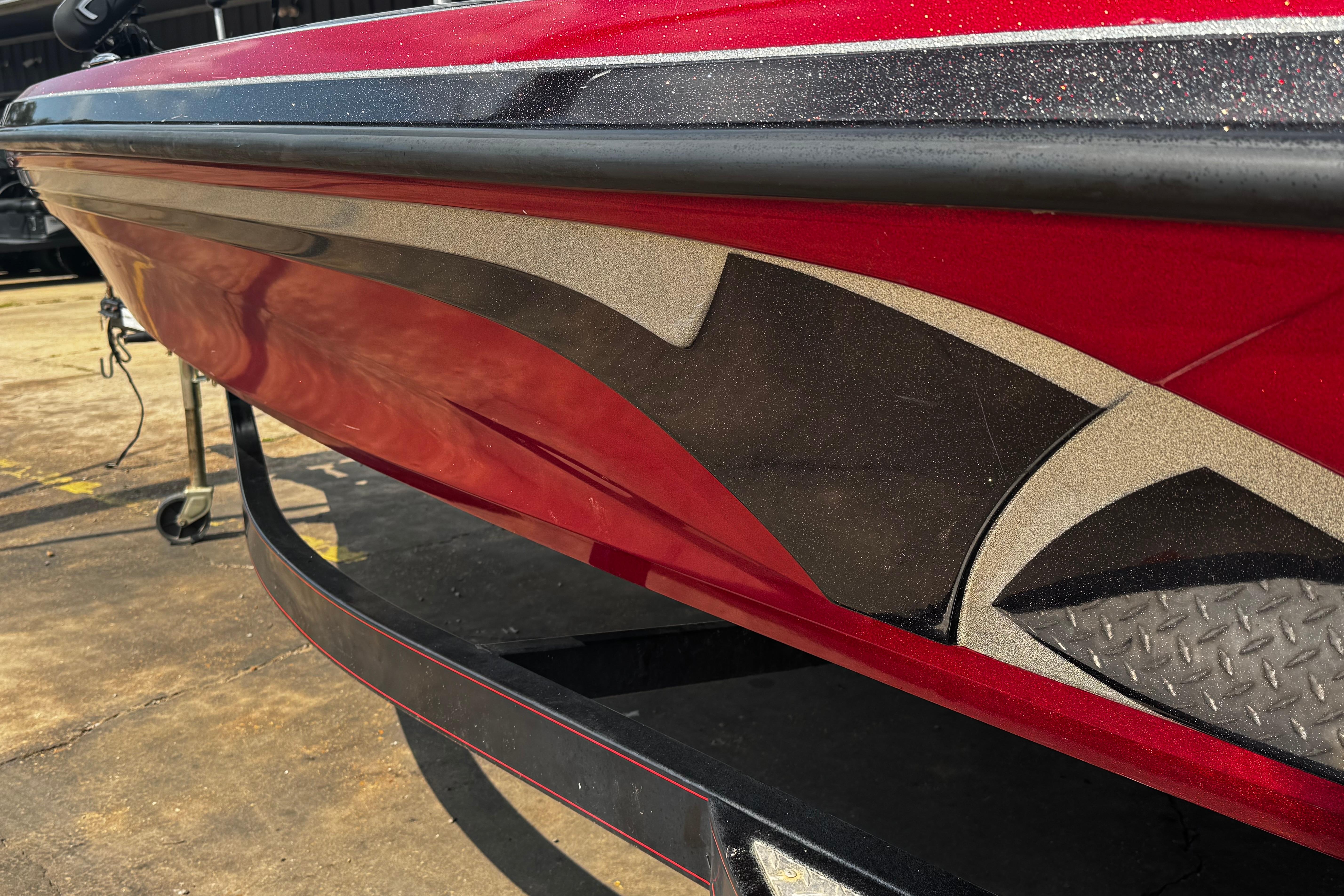 Red 2011 Nitro Z7 boat with sleek black and silver graphics on the hull.