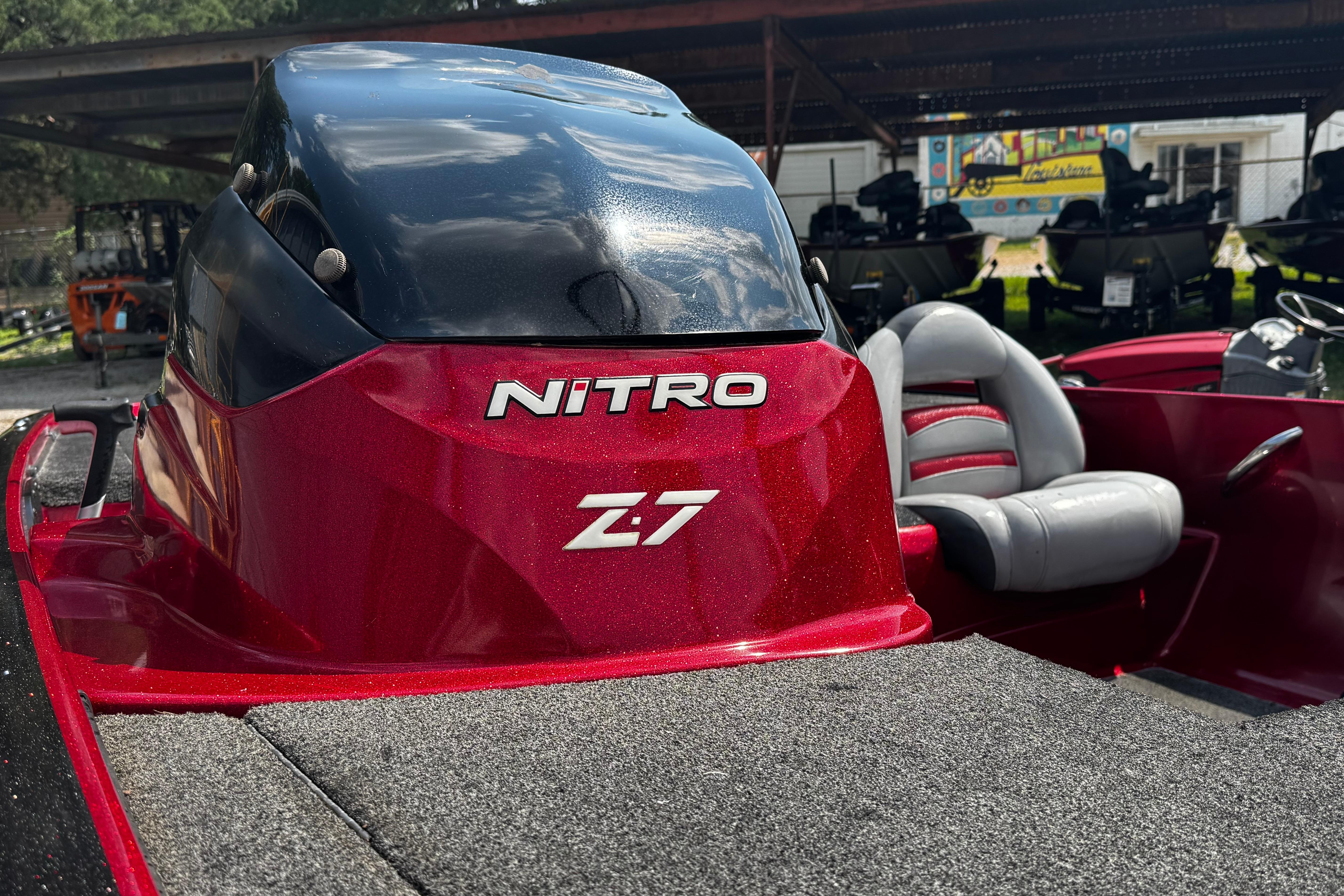 Red 2011 Nitro Z7 boat with sleek design and comfortable seating.