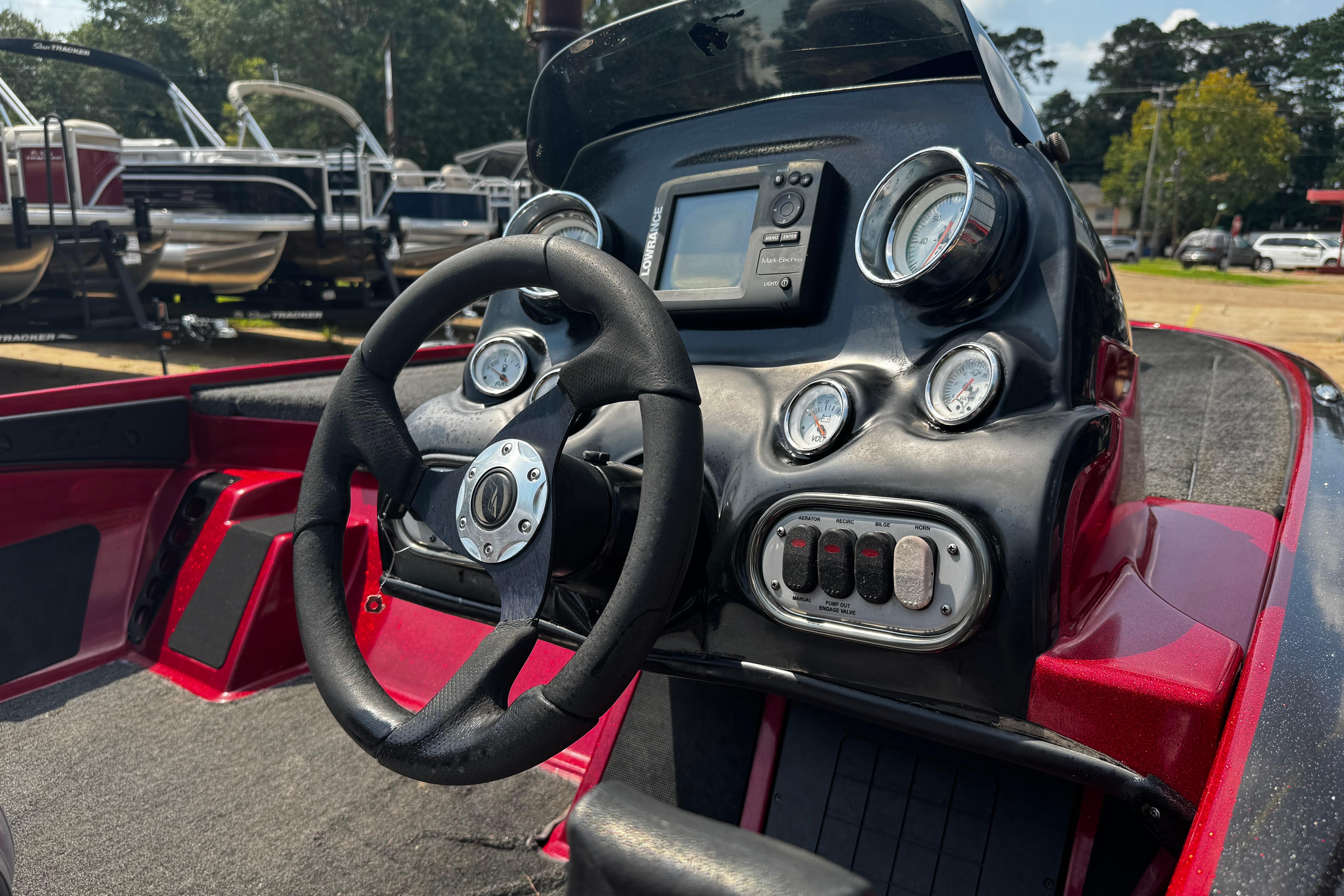 Steering console of a 2011 Nitro Z7 boat with gauges and controls.