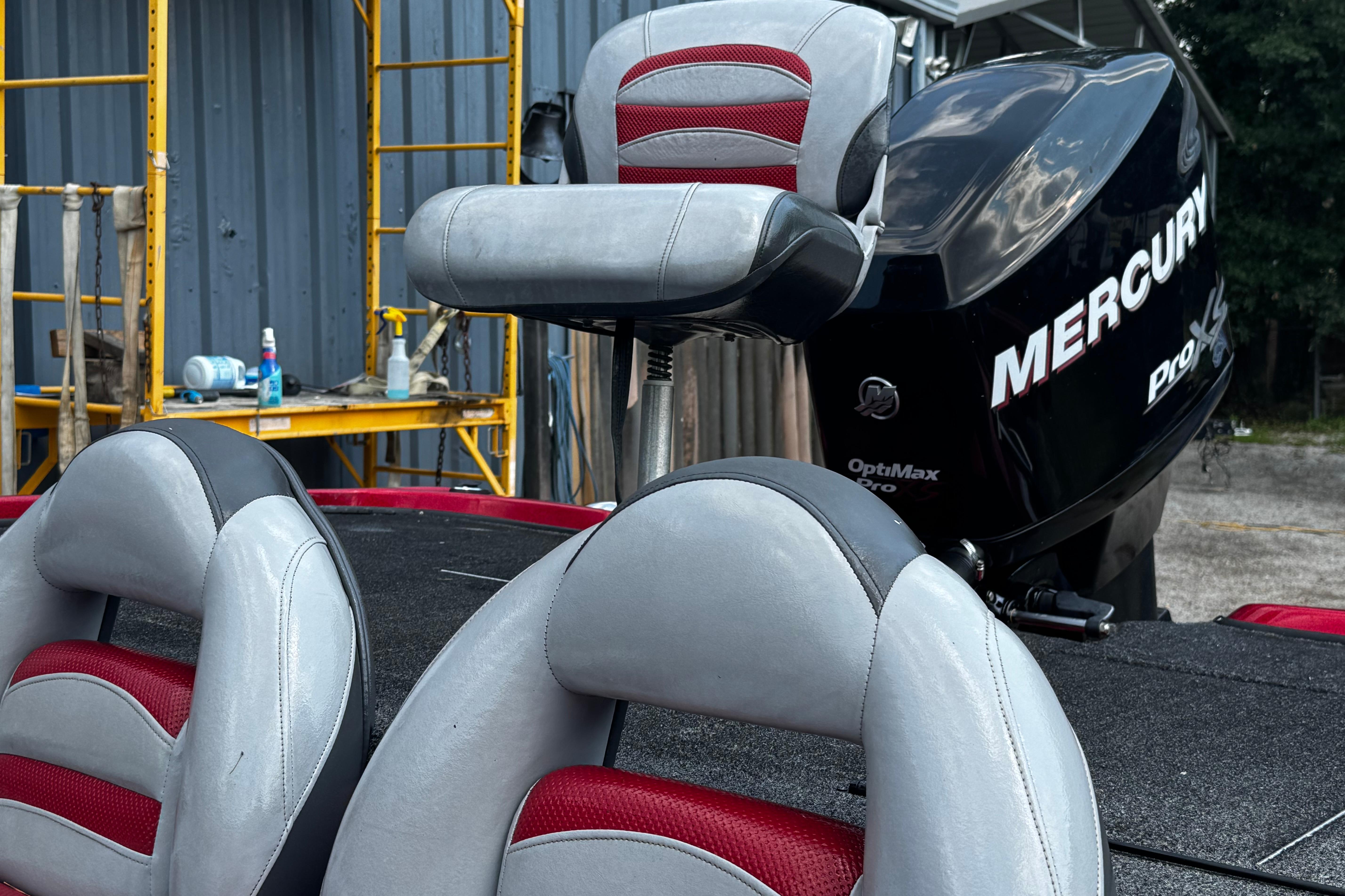 2011 Nitro Z7 boat with Mercury Pro XS engine and red-gray seating.