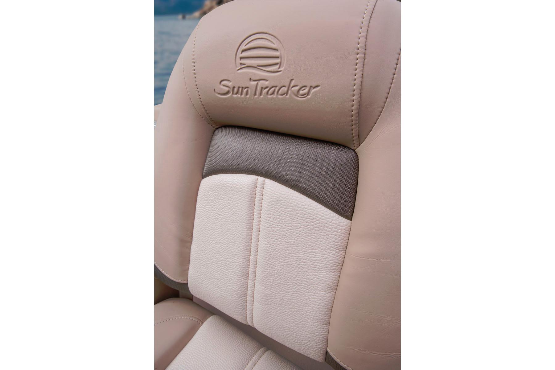 Sun Tracker Bass Buggy 18 DLX 2014 boat seat with logo, beige and gray upholstery.