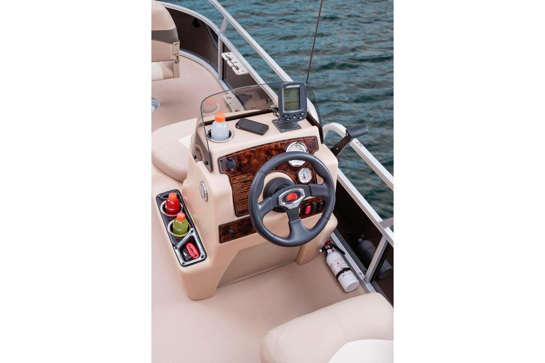 2014 Sun Tracker Bass Buggy 18 DLX boat console with steering wheel and navigation equipment.