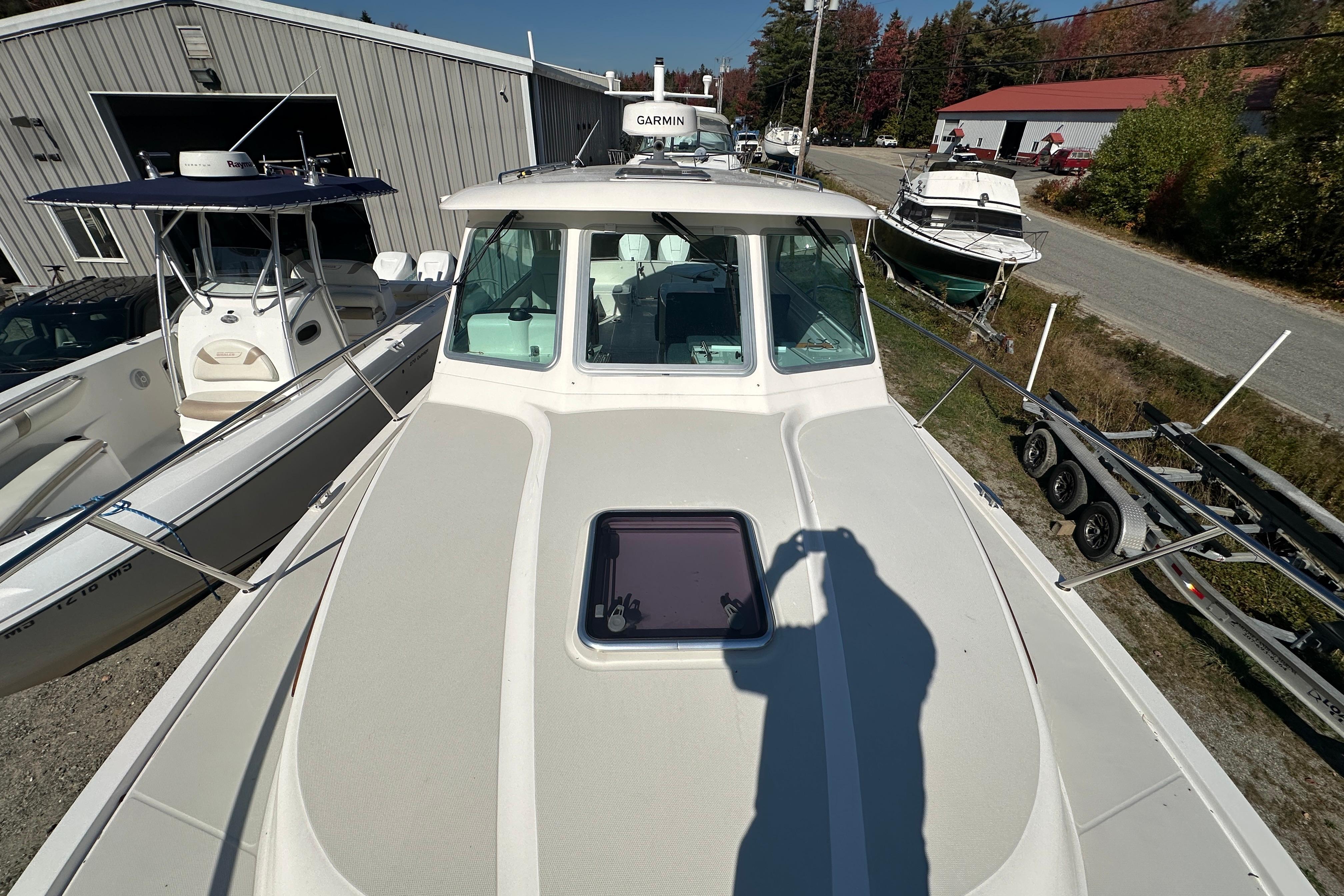 2024 Back Cove 34O boat docked, featuring a sleek design and spacious deck.