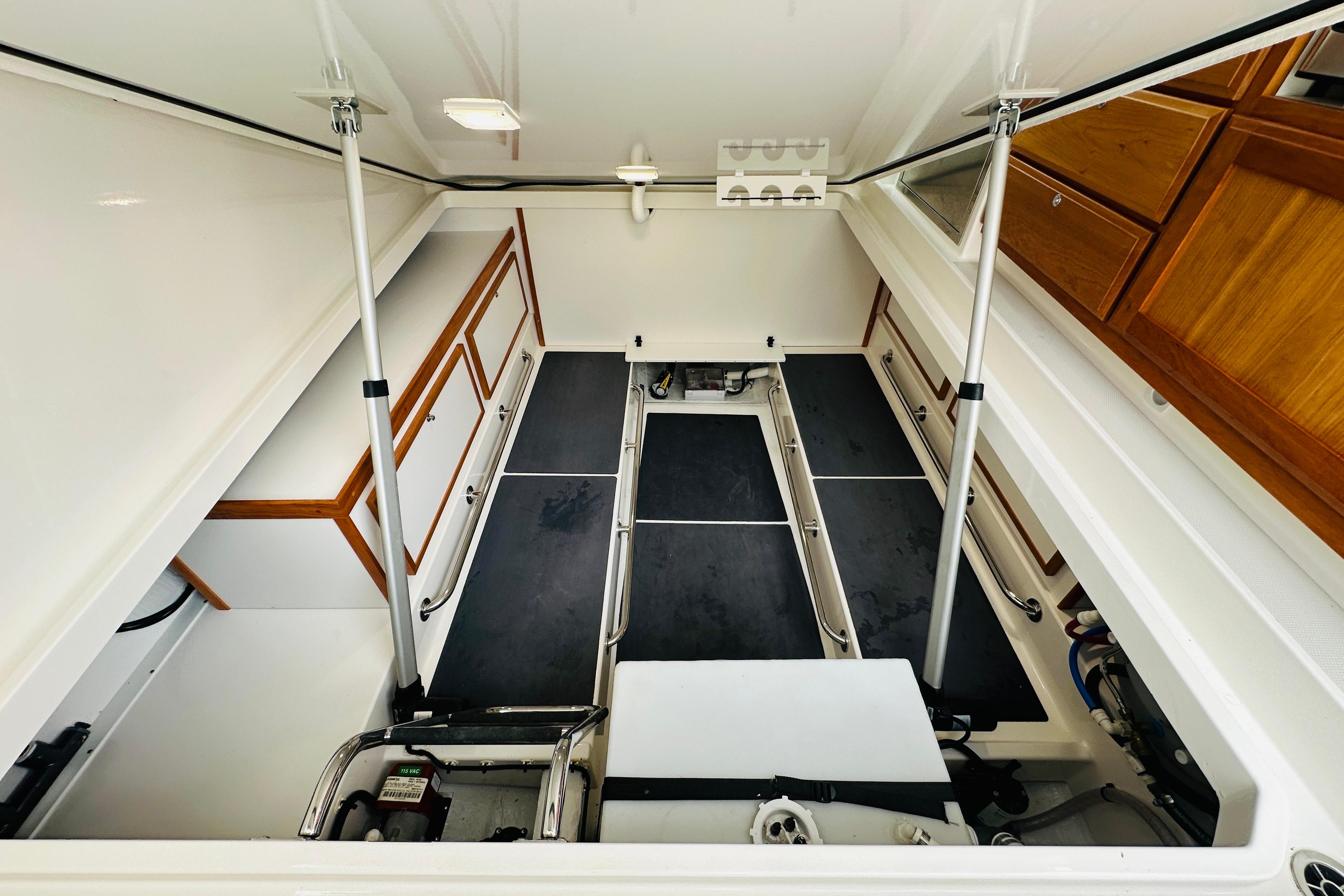 2024 Back Cove 34O engine compartment with organized storage and sleek design.