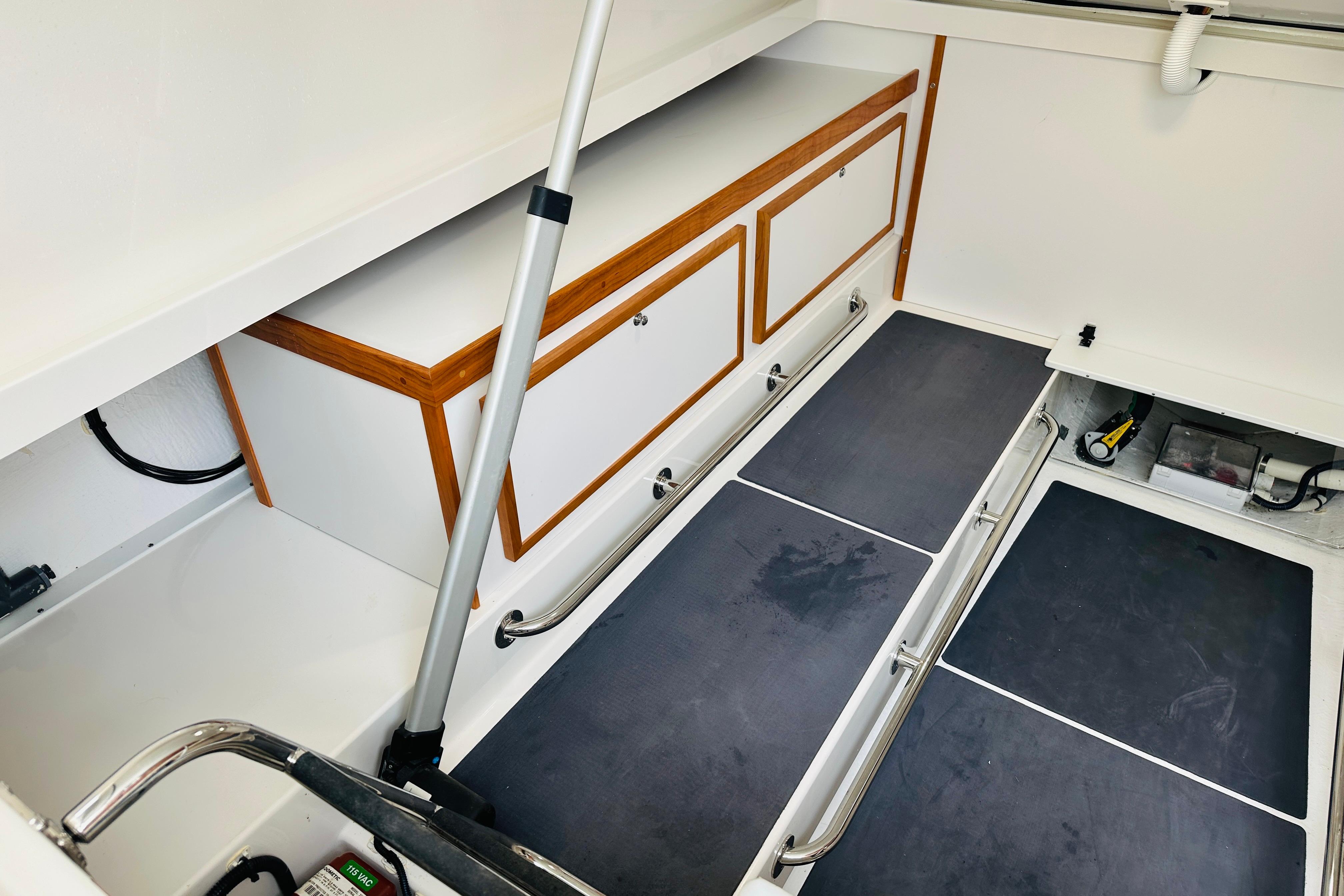 2024 Back Cove 34O interior storage area with sleek cabinetry and modern design.