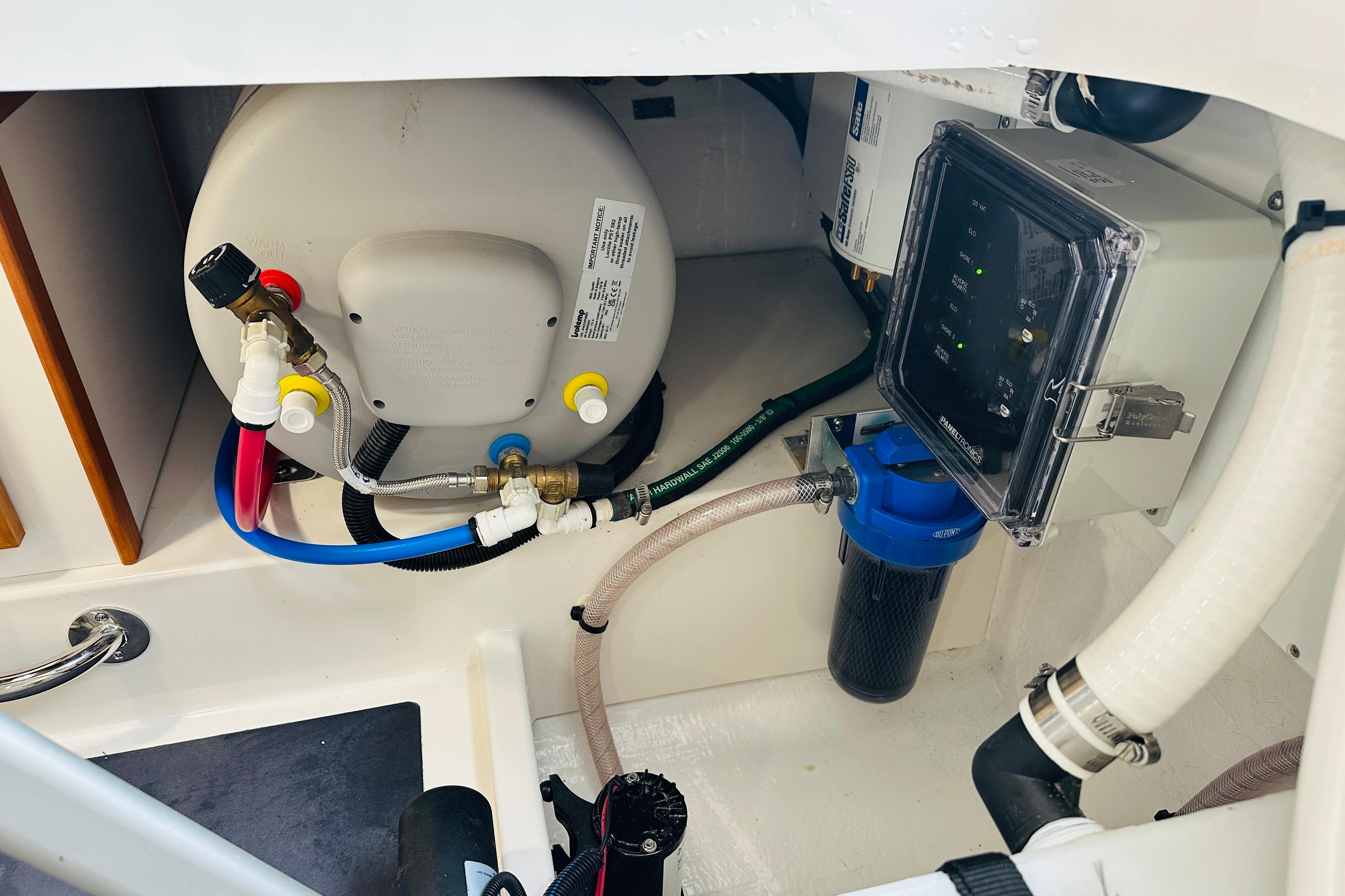 2024 Back Cove 34O engine compartment with water heater and filtration system.