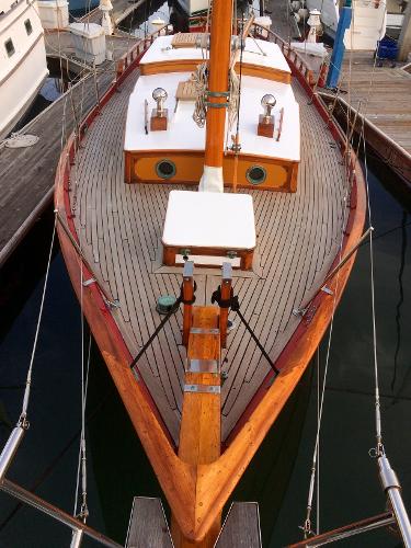 1971 Formosa 41 sailboat with wooden deck, docked at marina.
