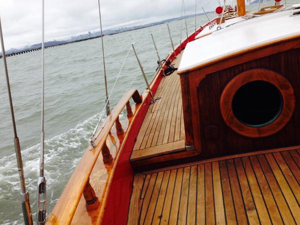Wooden deck of a 1971 Formosa 41 sailboat on the water.