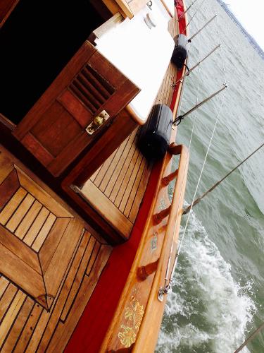 1971 Formosa 41 sailboat with wooden deck, sailing on open water.