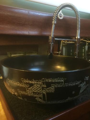 Vintage Formosa 41 sink with intricate design, featuring a modern faucet, 1971 model.