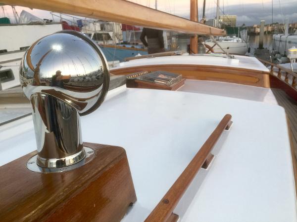 1971 Formosa 41 yacht deck with polished metal and wooden details in a marina setting.