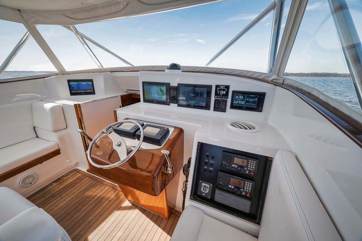 Garlington-44 Express 1996 -FL-US-1996 Garlington 44 Express yacht cockpit with modern navigation equipment and wooden accents.-9651424 | Thumbnail