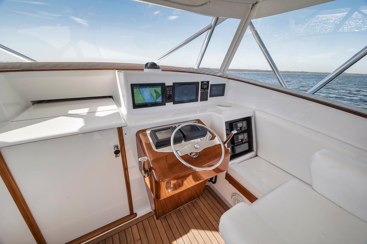 Garlington-44 Express 1996 -FL-US-1996 Garlington 44 Express boat helm with modern navigation equipment and wooden accents.-9651424 | Thumbnail