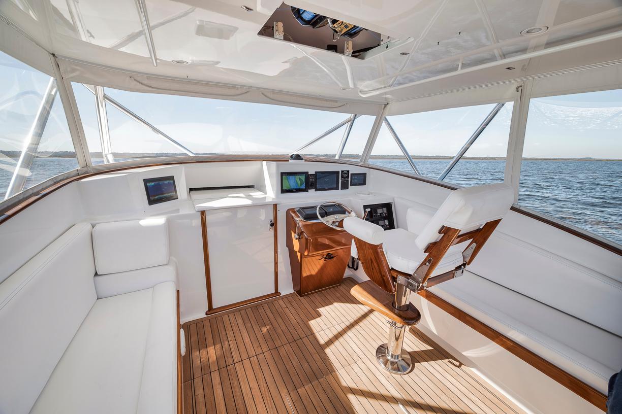 Garlington-44 Express 1996 -FL-US-Interior of 1996 Garlington 44 Express yacht with wooden flooring and white seating.-9651424 | Thumbnail