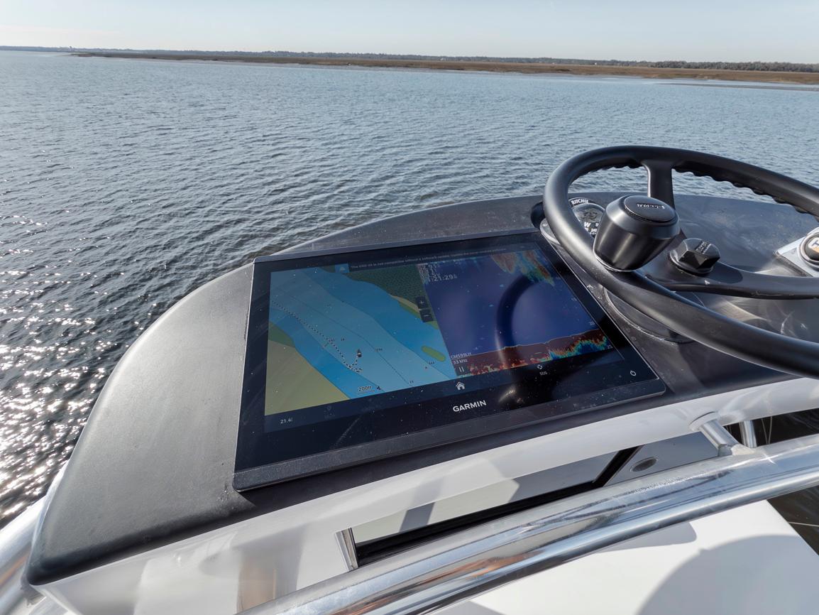 Garlington-44 Express 1996 -FL-US-Garlington 44 Express 1996 helm with navigation display on calm water.-9651424 | Thumbnail