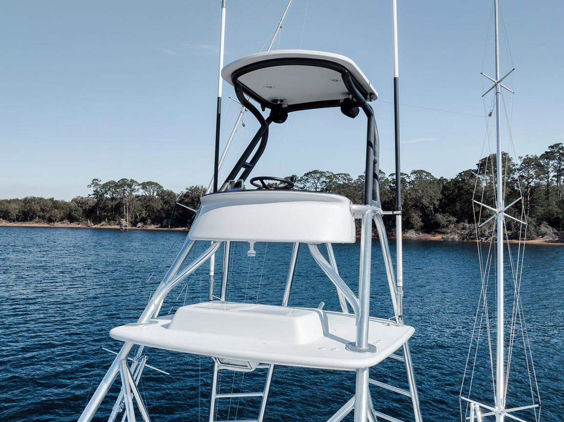 Garlington-44 Express 1996 -FL-US-1996 Garlington 44 Express boat tower with helm, on calm water, clear sky background.-9651424 | Thumbnail