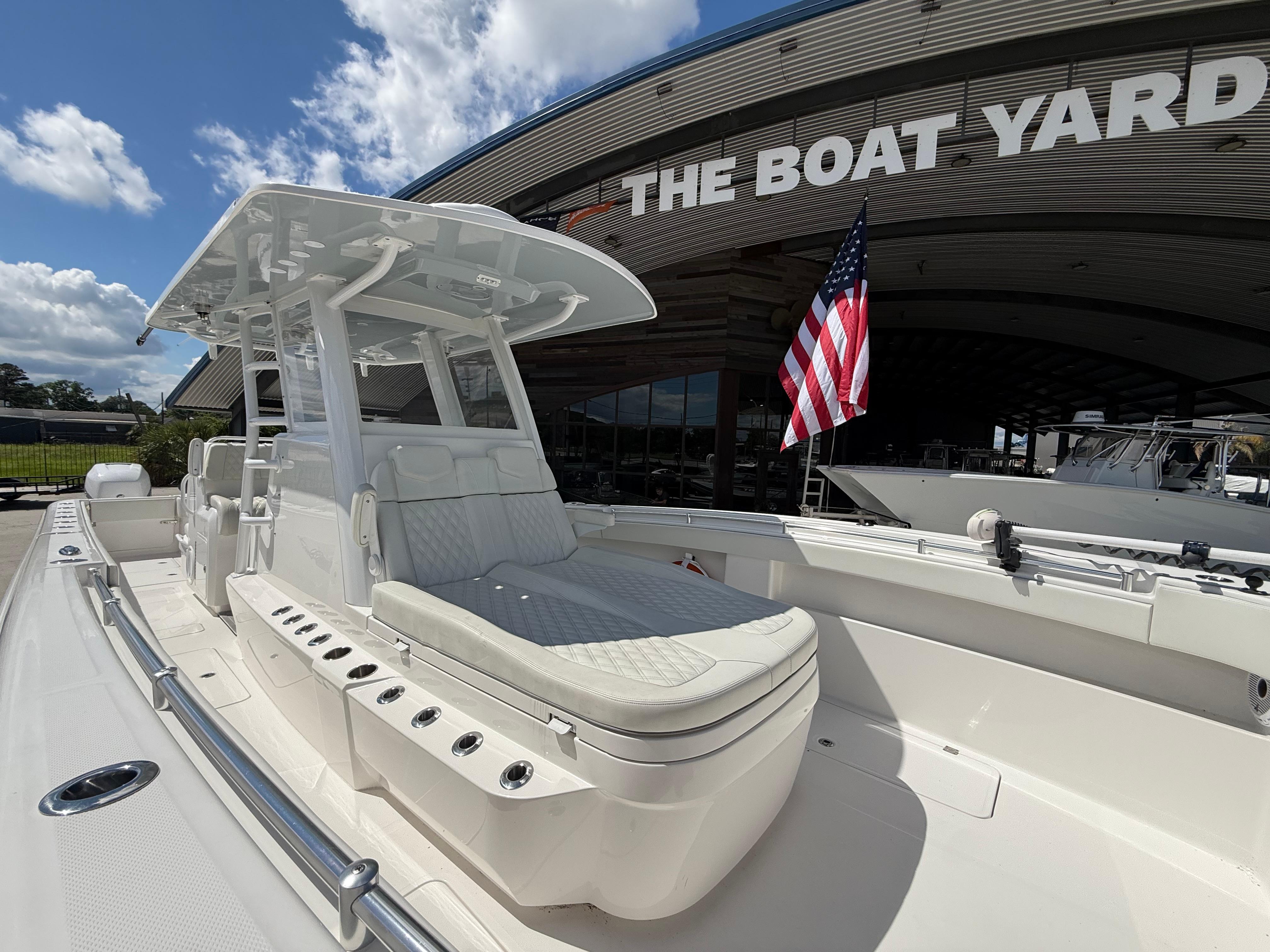 2022 Invincible 33 Catamaran at The Boat Yard, featuring sleek design and American flag.
