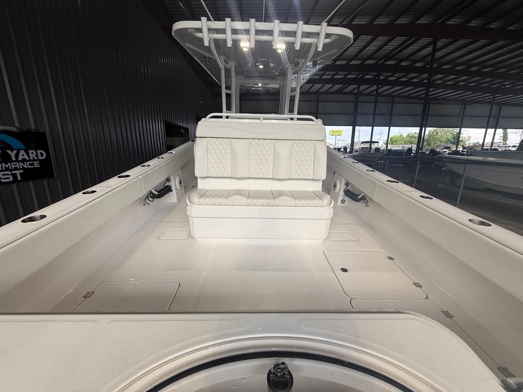 2022 Invincible 33 Catamaran interior with seating, under a metal roof.