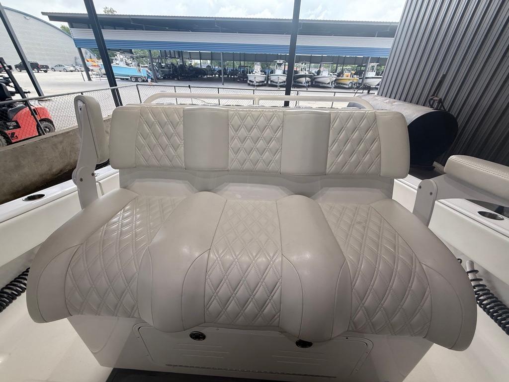 Luxurious seating on 2022 Invincible 33 Catamaran, featuring diamond-stitched upholstery.