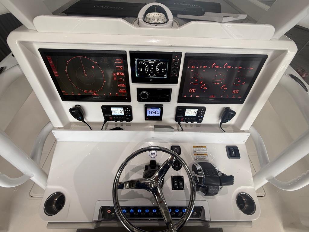 Cockpit of 2022 Invincible 33 Catamaran with advanced navigation and control systems.