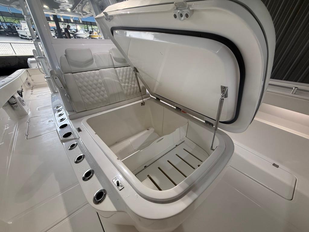 2022 Invincible 33 Catamaran with open storage compartment and seating area.