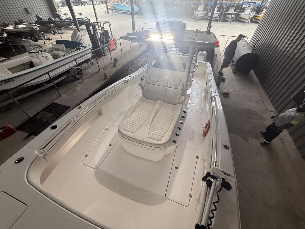 2022 Invincible 33 Catamaran boat interior with cushioned seating in a storage facility.
