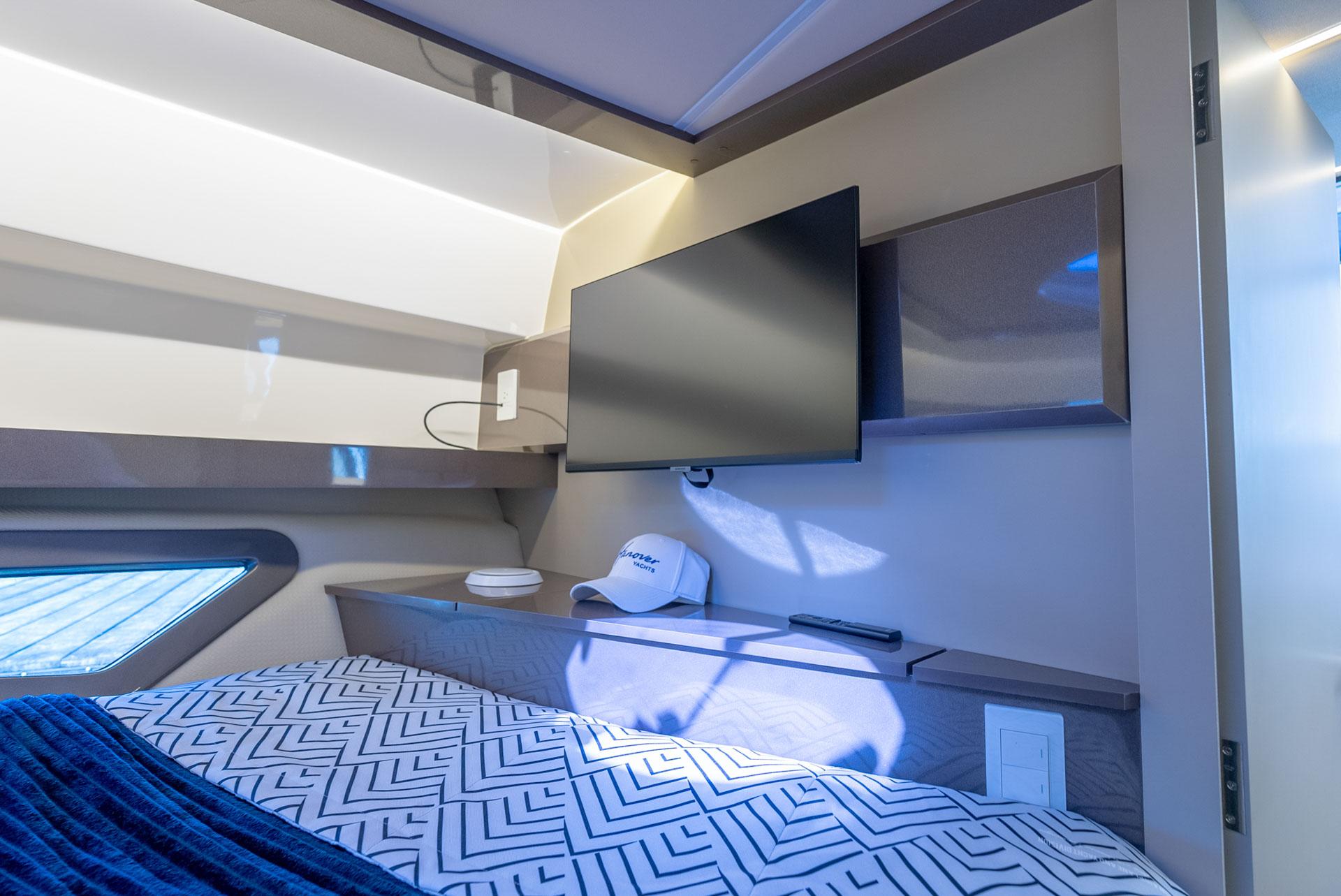 Hanover-415 2024-Music FL-US-Modern bedroom interior in 2024 Hanover 415 yacht with TV and stylish decor.-9751409 | Thumbnail