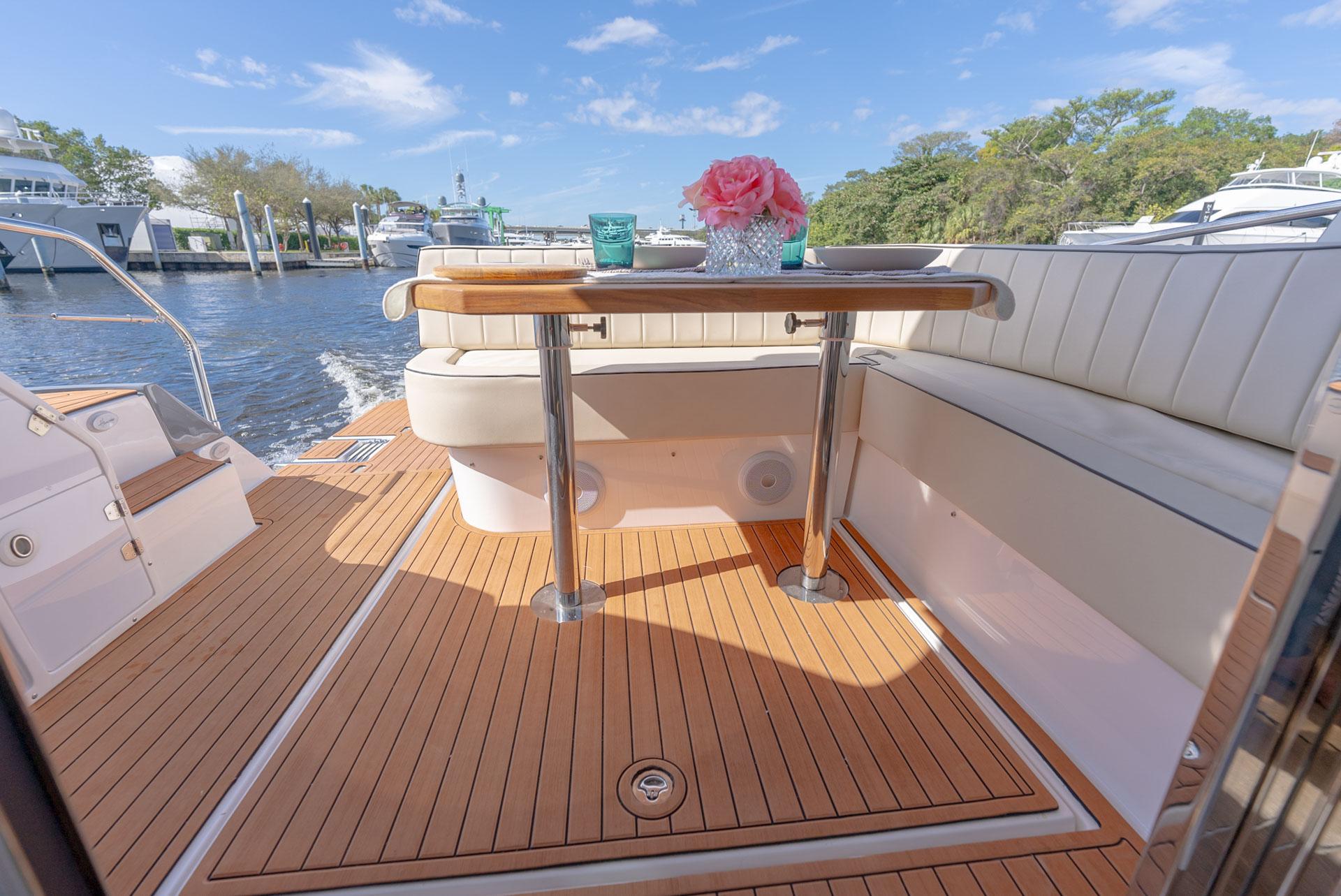 Hanover-415 2024-Music FL-US-Luxurious 2024 Hanover 415 yacht deck with elegant seating and table, docked by the water.-9751409 | Thumbnail