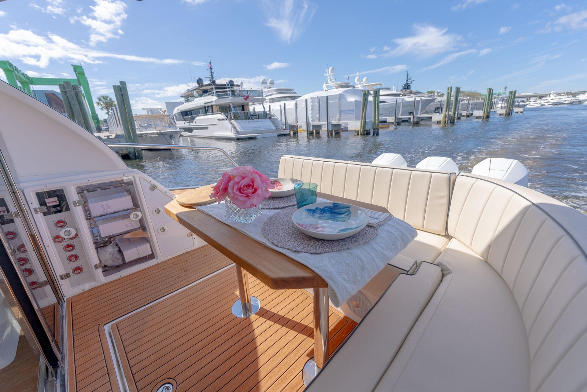Hanover-415 2024-Music FL-US-Luxurious 2024 Hanover 415 yacht interior with elegant dining setup, docked at a marina.-9751409 | Thumbnail
