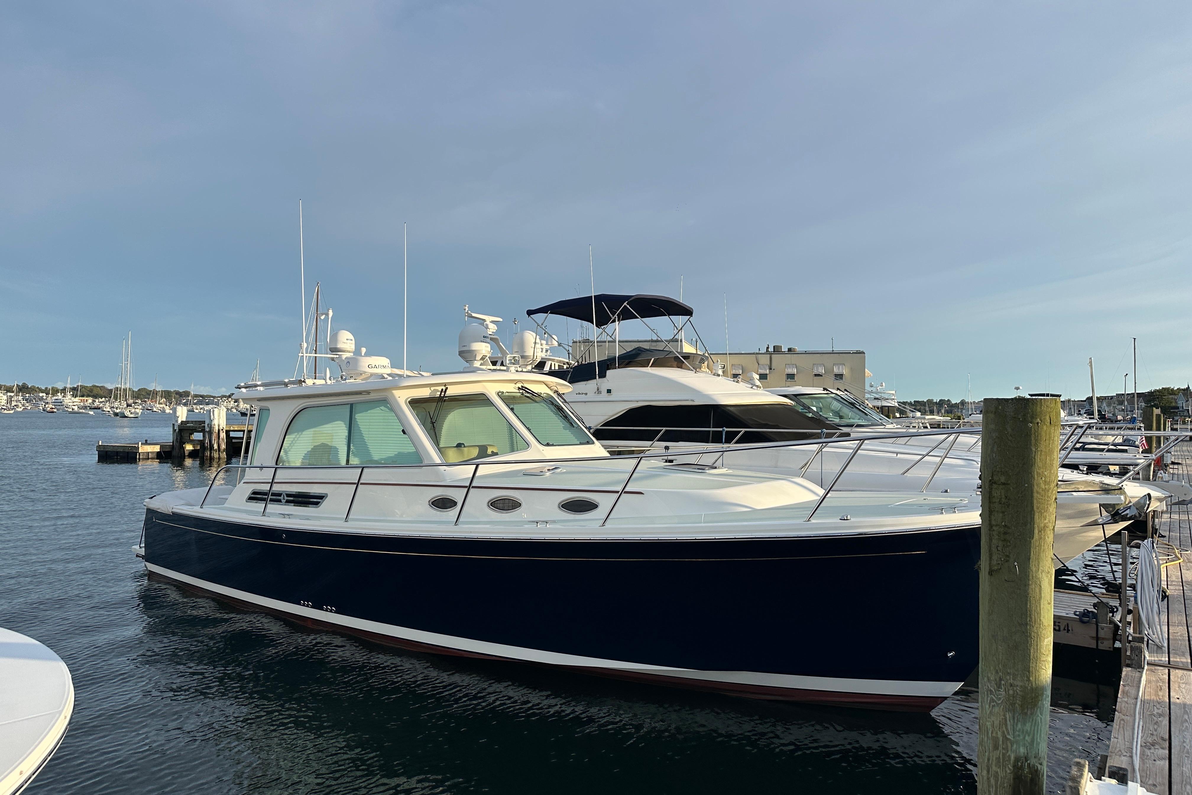 2020 Back Cove 37 yacht docked at marina, featuring sleek design and modern amenities.