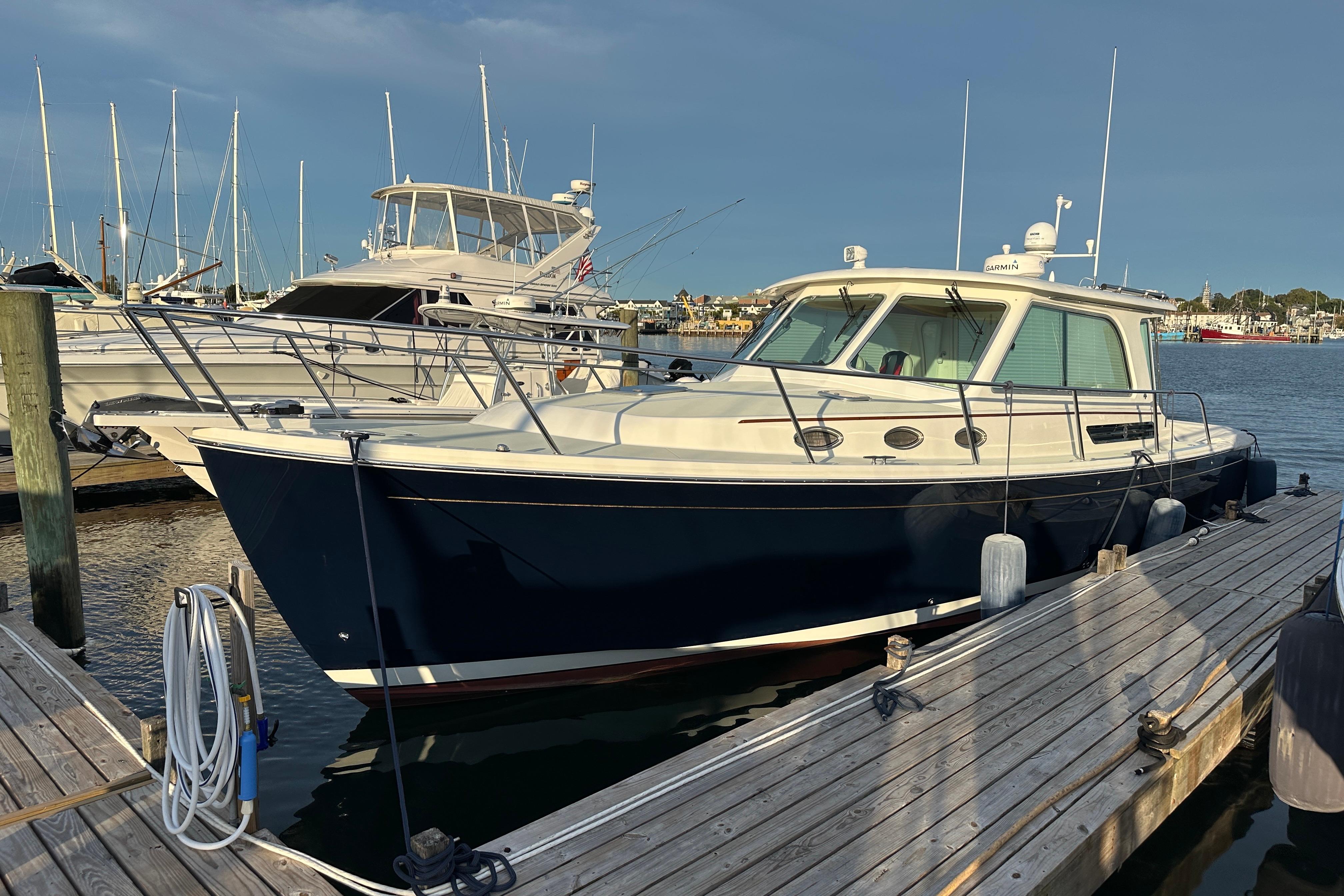 2020 Back Cove 37 boat docked at marina, surrounded by other vessels.