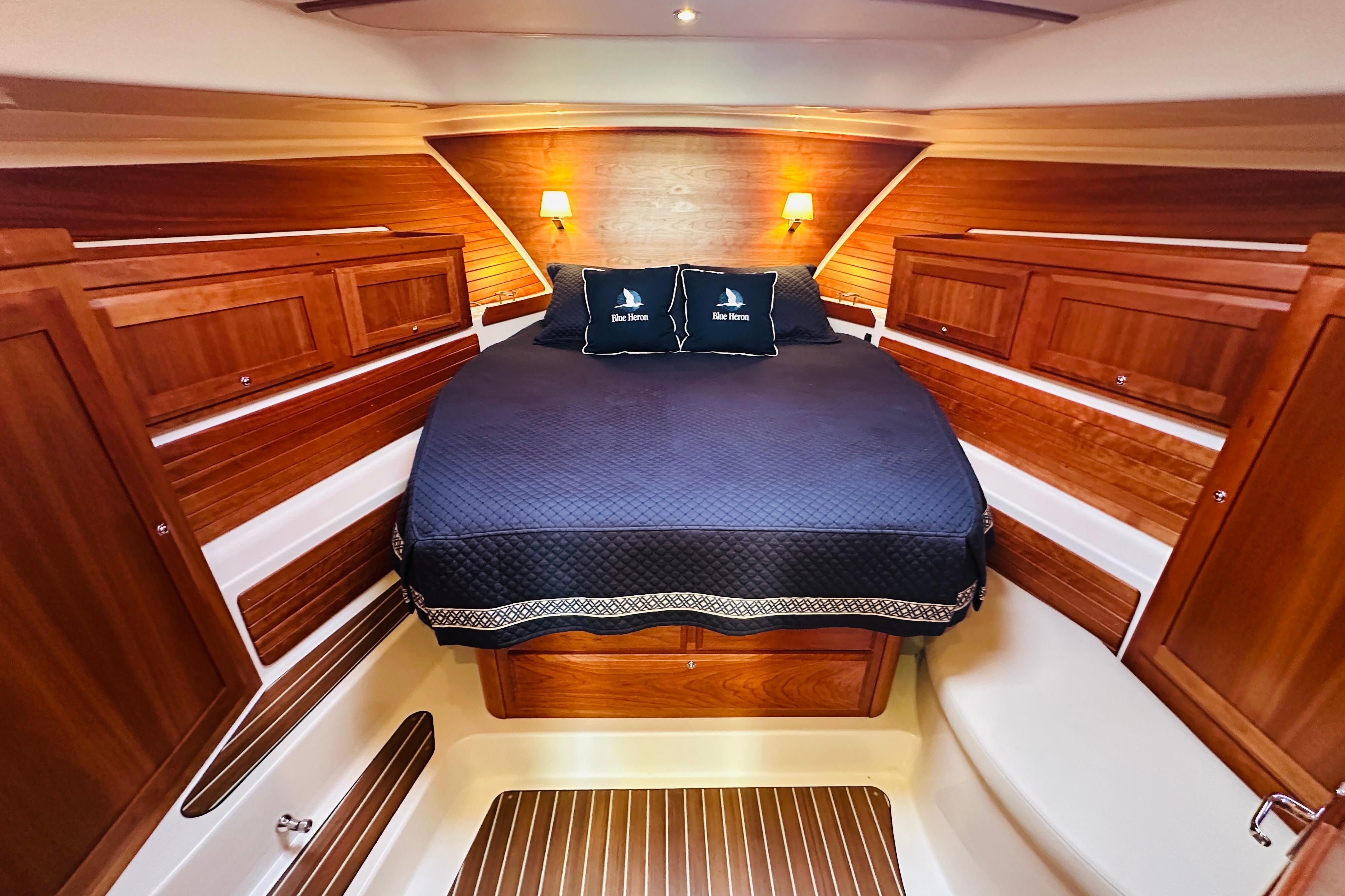 Luxurious cabin interior of 2020 Back Cove 37 yacht with elegant wood finish.
