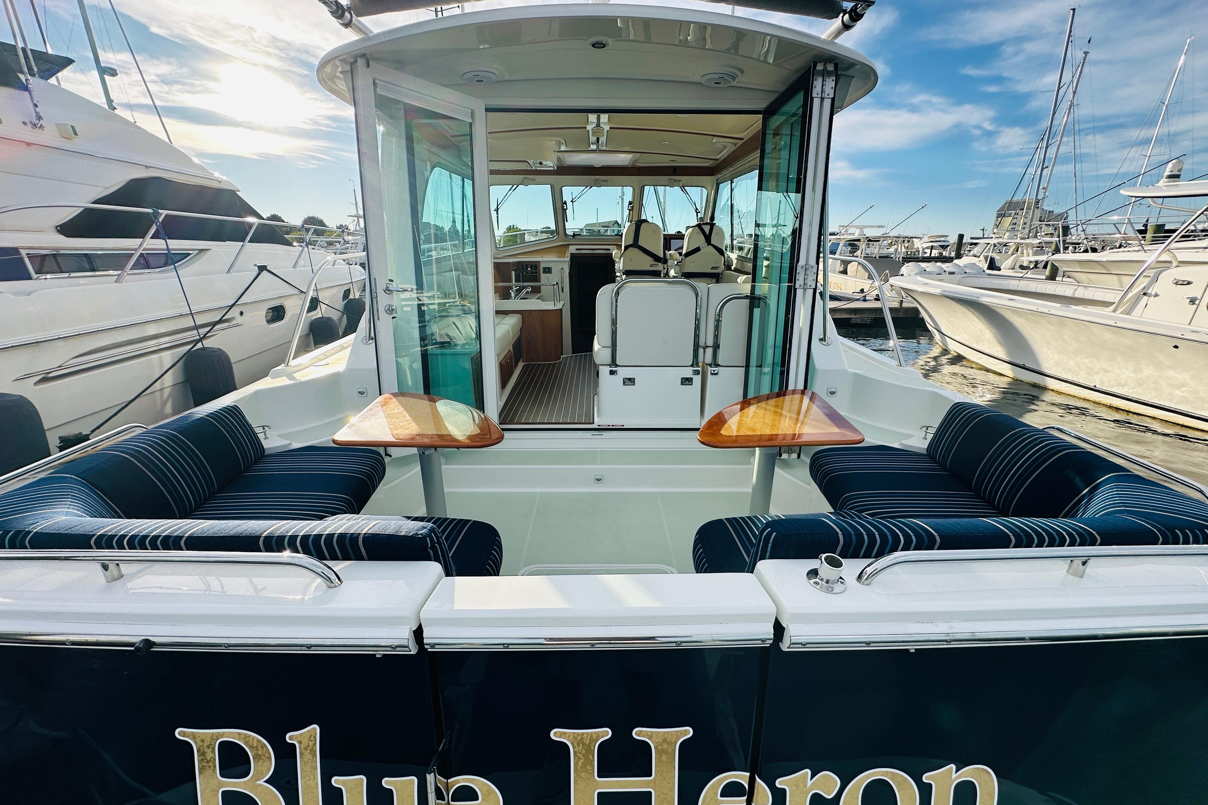 2020 Back Cove 37 yacht with elegant seating and marina view.