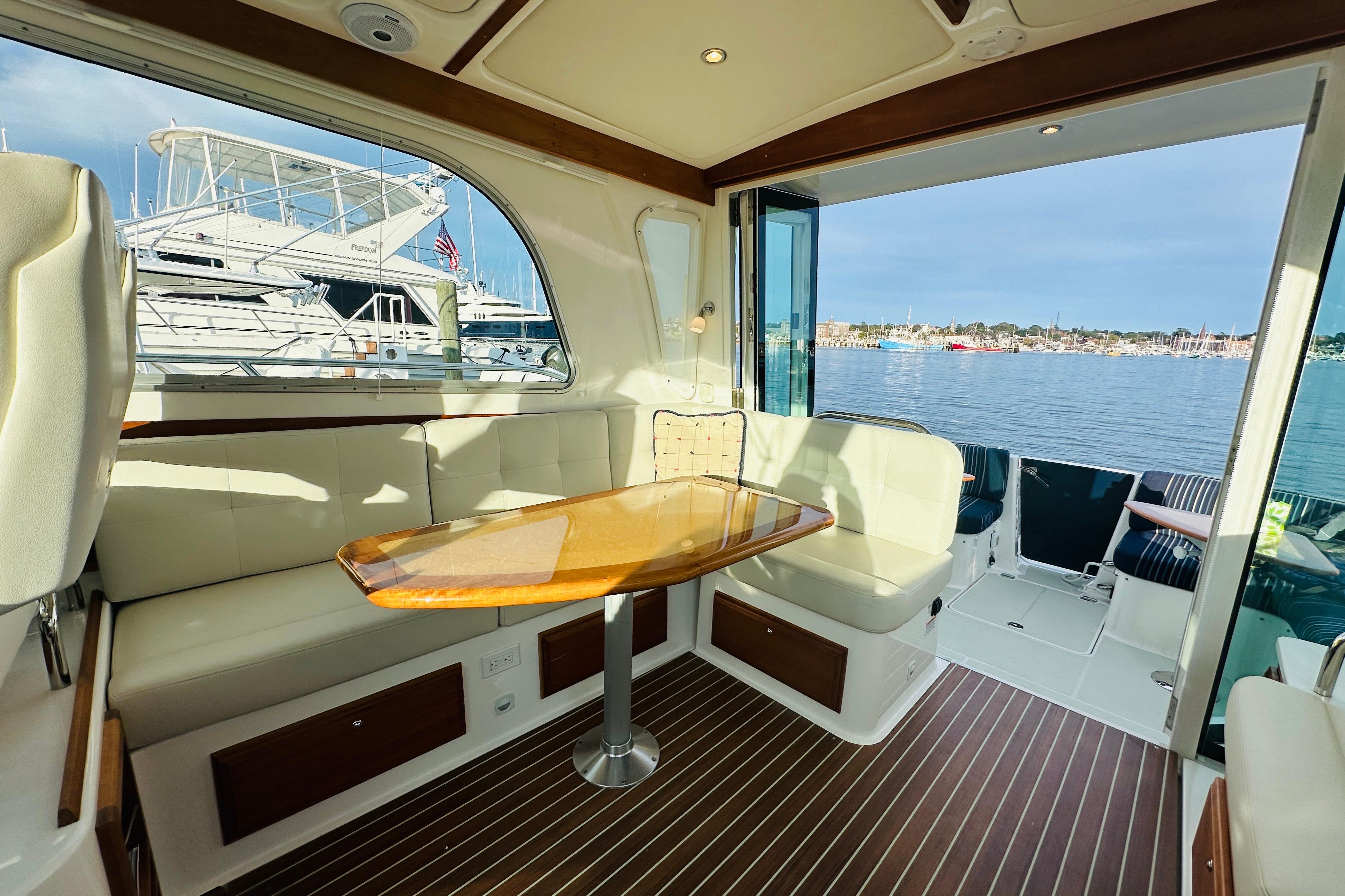 Interior of 2020 Back Cove 37 yacht with elegant seating and waterfront view.