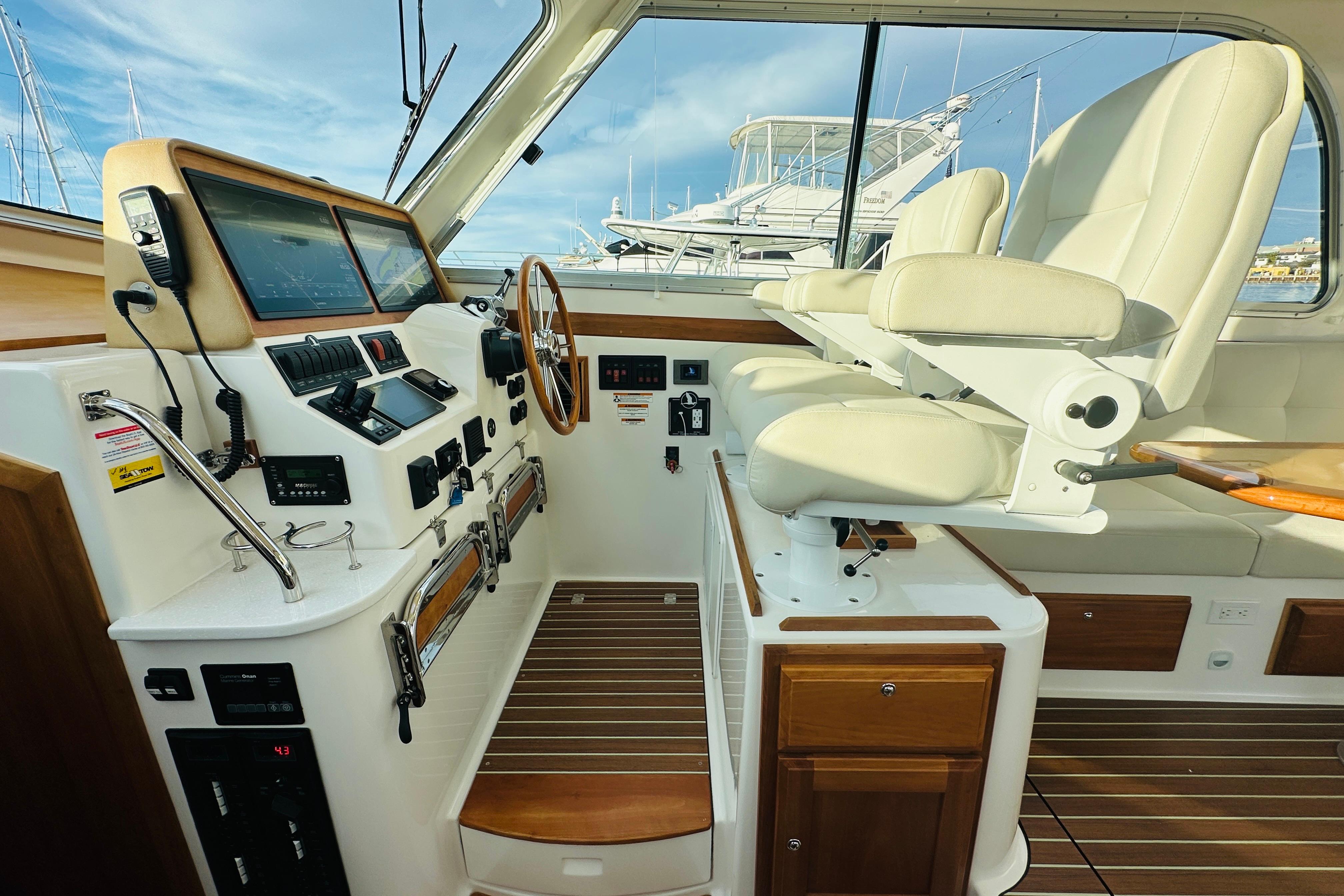 2020 Back Cove 37 helm with modern controls, dual seats, and wooden accents.