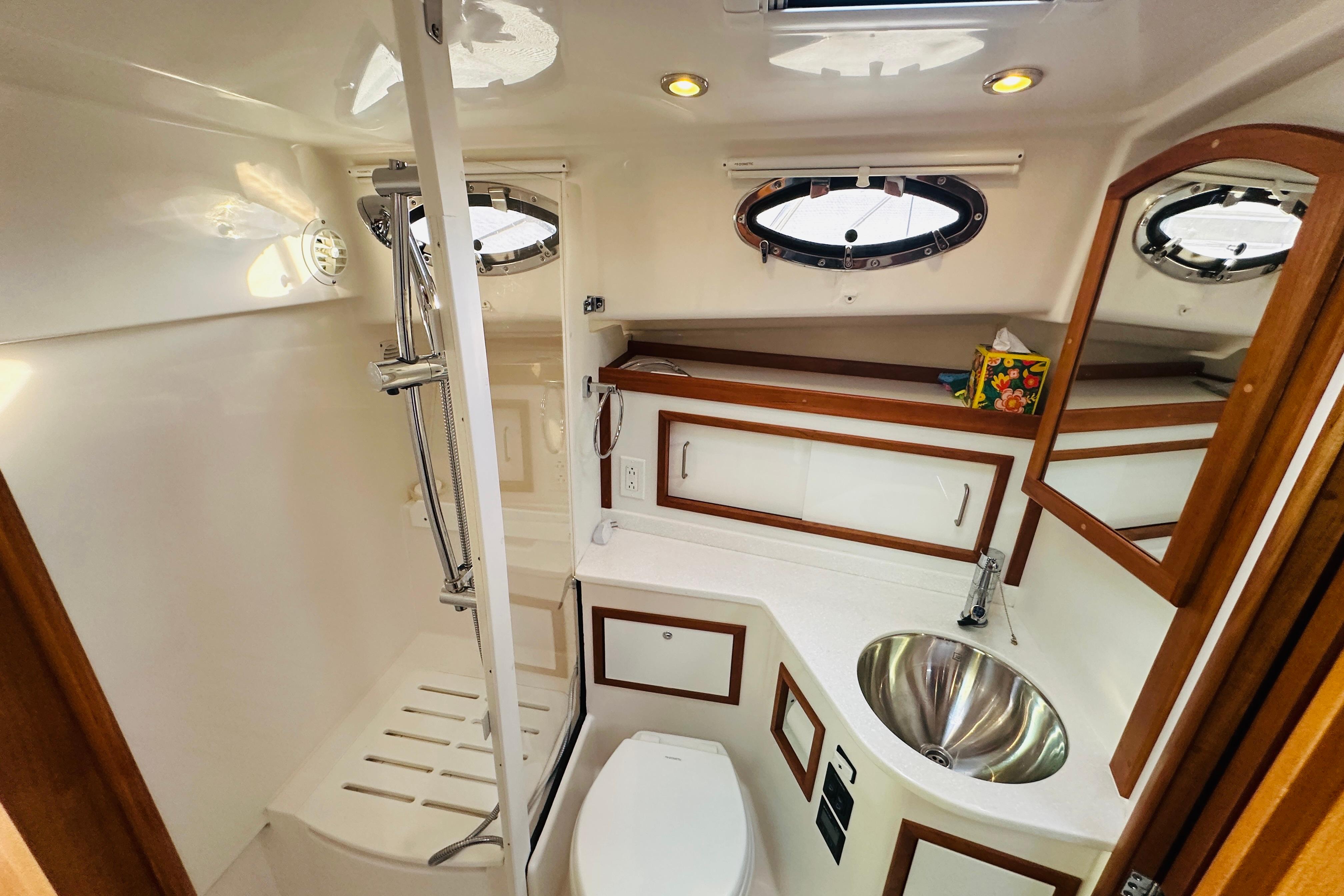 Luxurious bathroom in 2020 Back Cove 37 yacht with modern fixtures and wood accents.