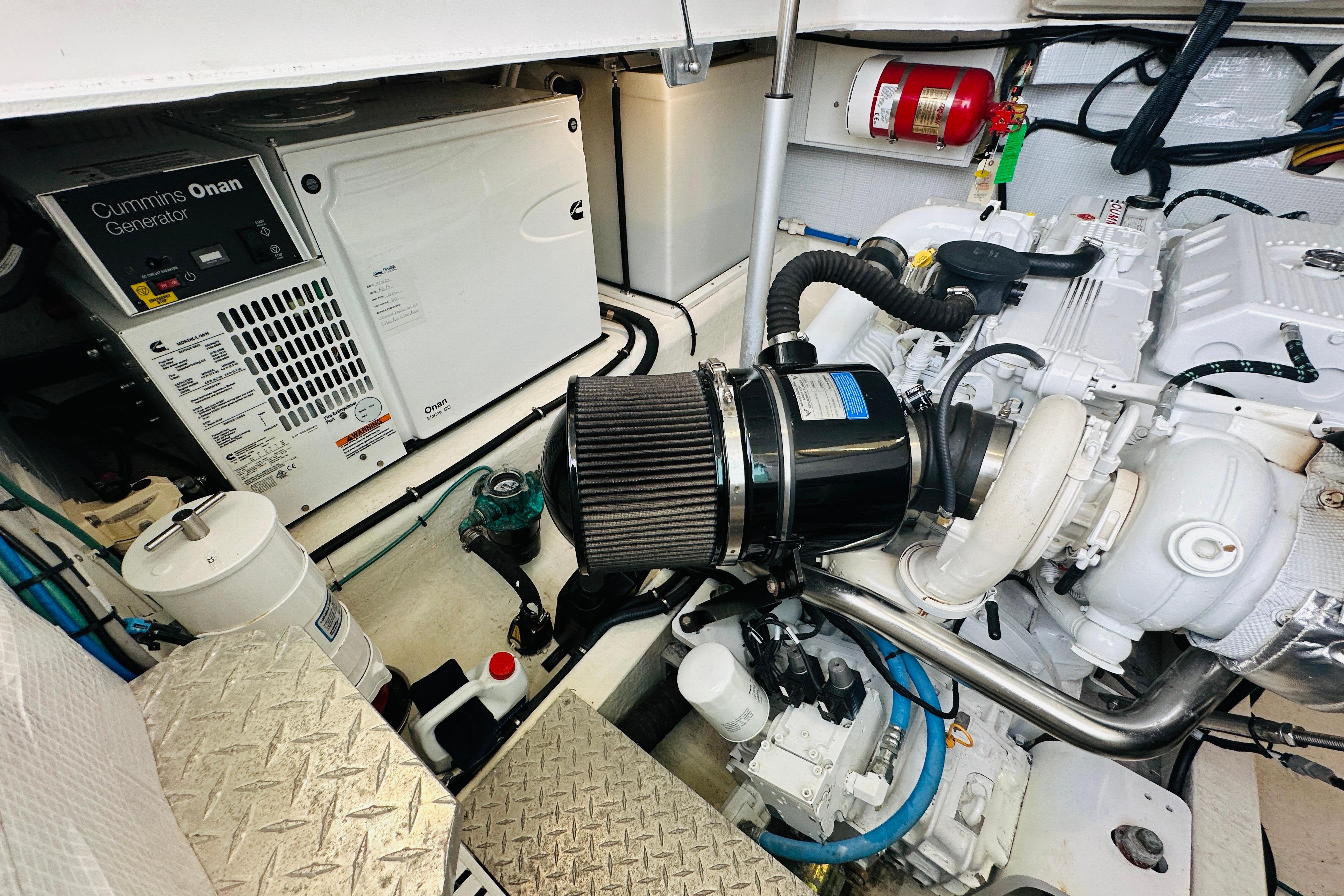 Engine room of 2020 Back Cove 37 with Cummins Onan generator and mechanical components.