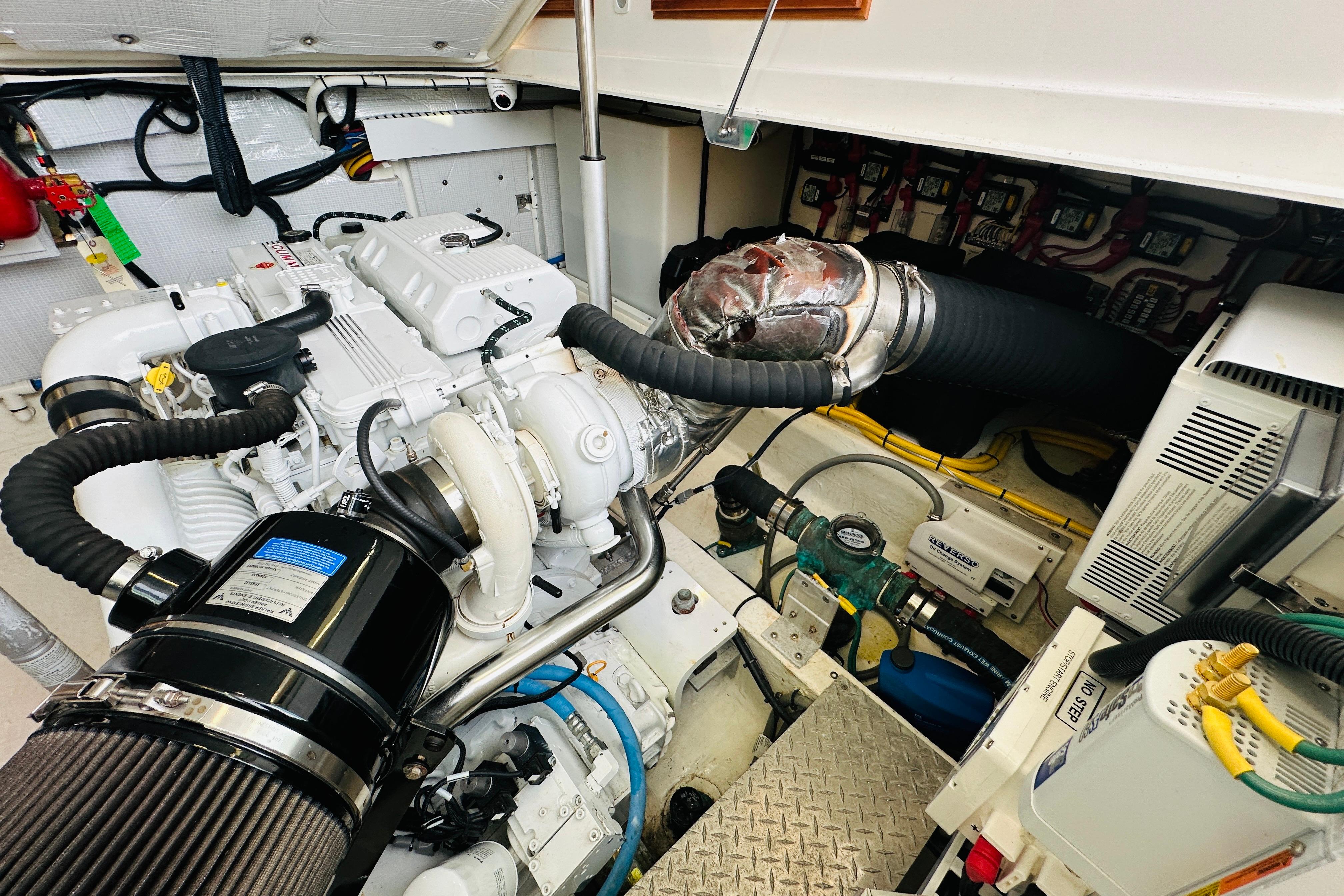 Engine room of 2020 Back Cove 37 boat, showcasing detailed mechanical components.