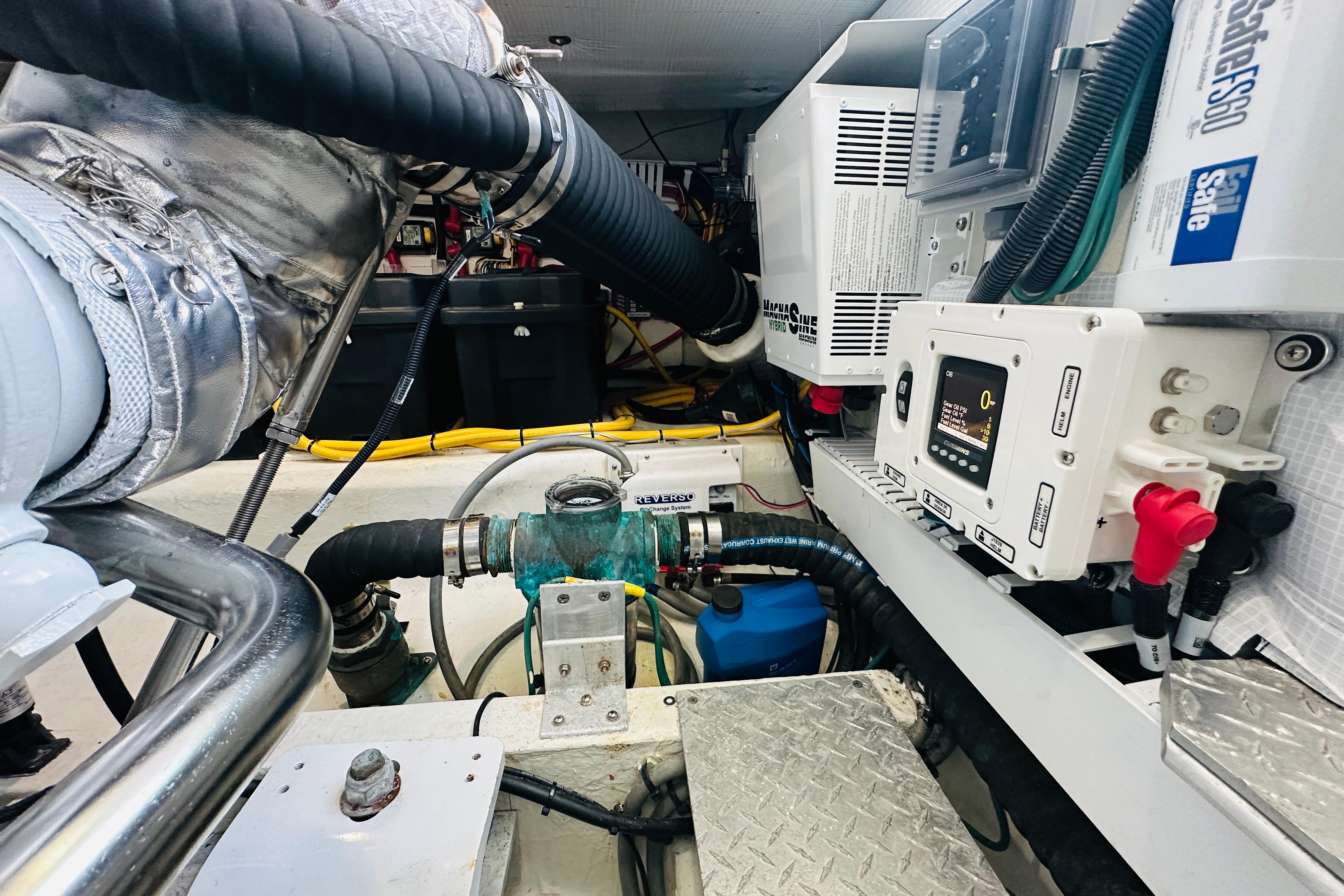 Engine room of a 2020 Back Cove 37 boat, showcasing mechanical components and wiring.