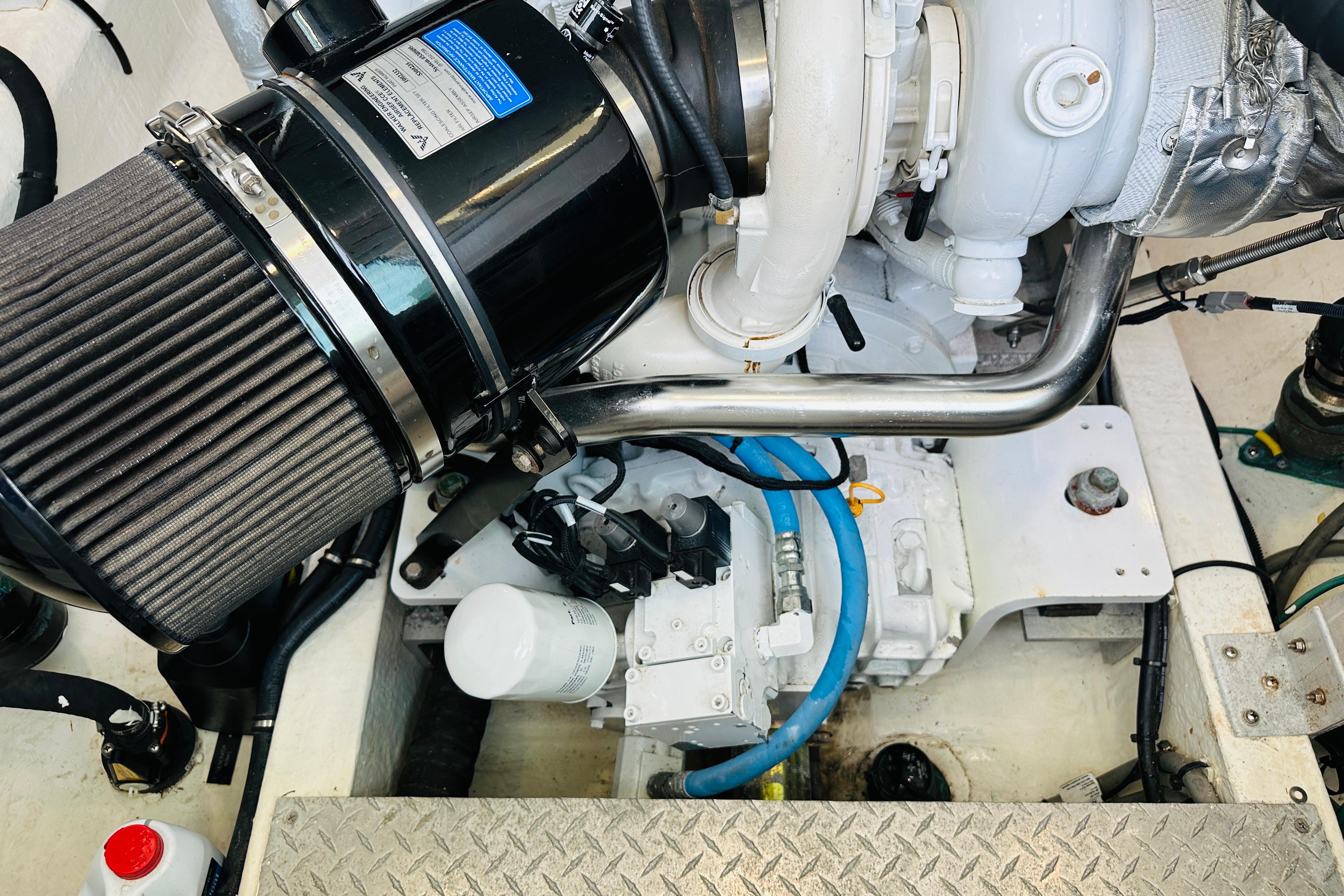 Engine compartment of a 2020 Back Cove 37 boat, showcasing mechanical components.