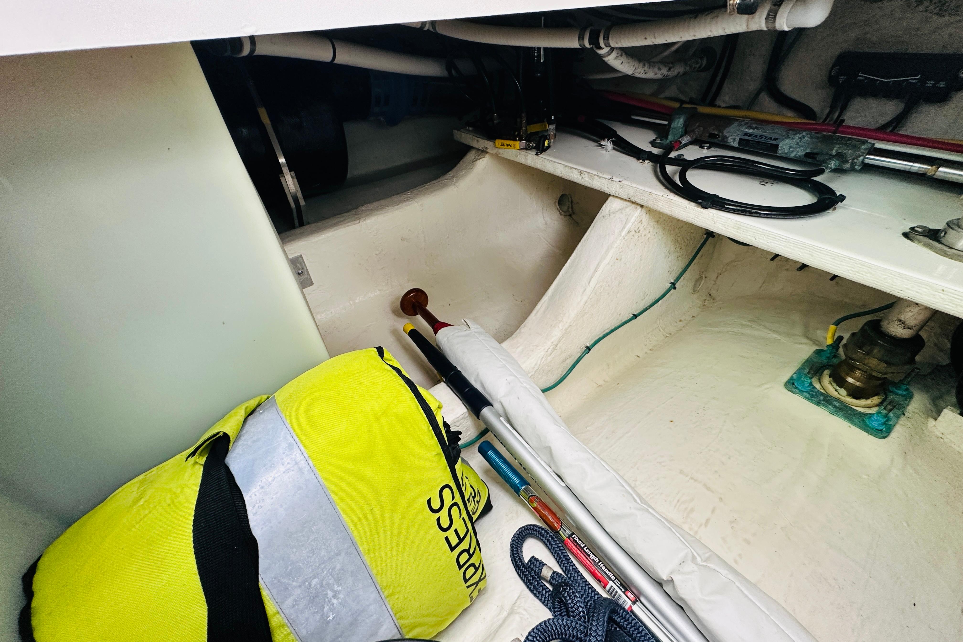 Interior of 2020 Back Cove 37 boat showing storage area with equipment and cables.