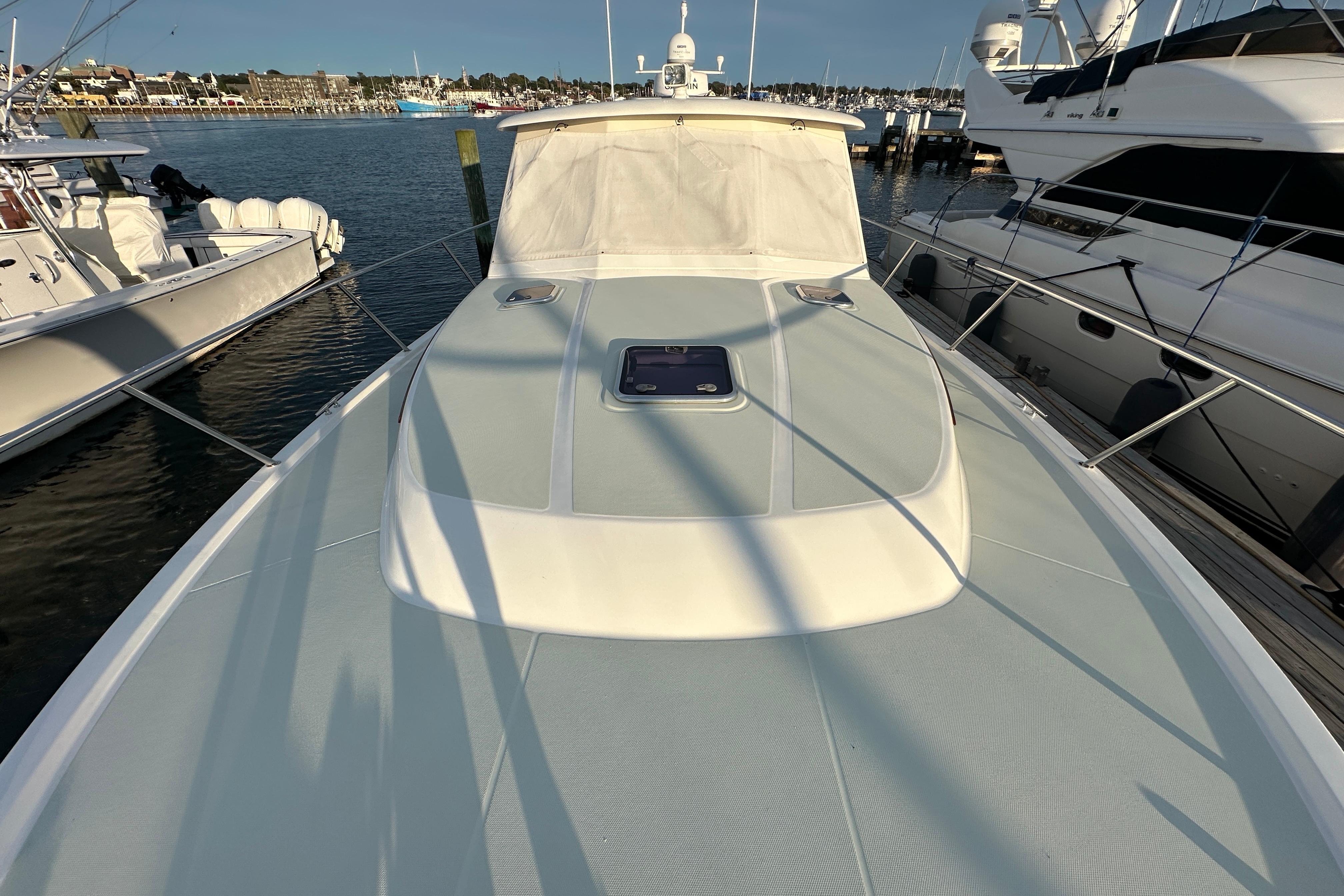 2020 Back Cove 37 yacht docked at marina, showcasing sleek deck design.
