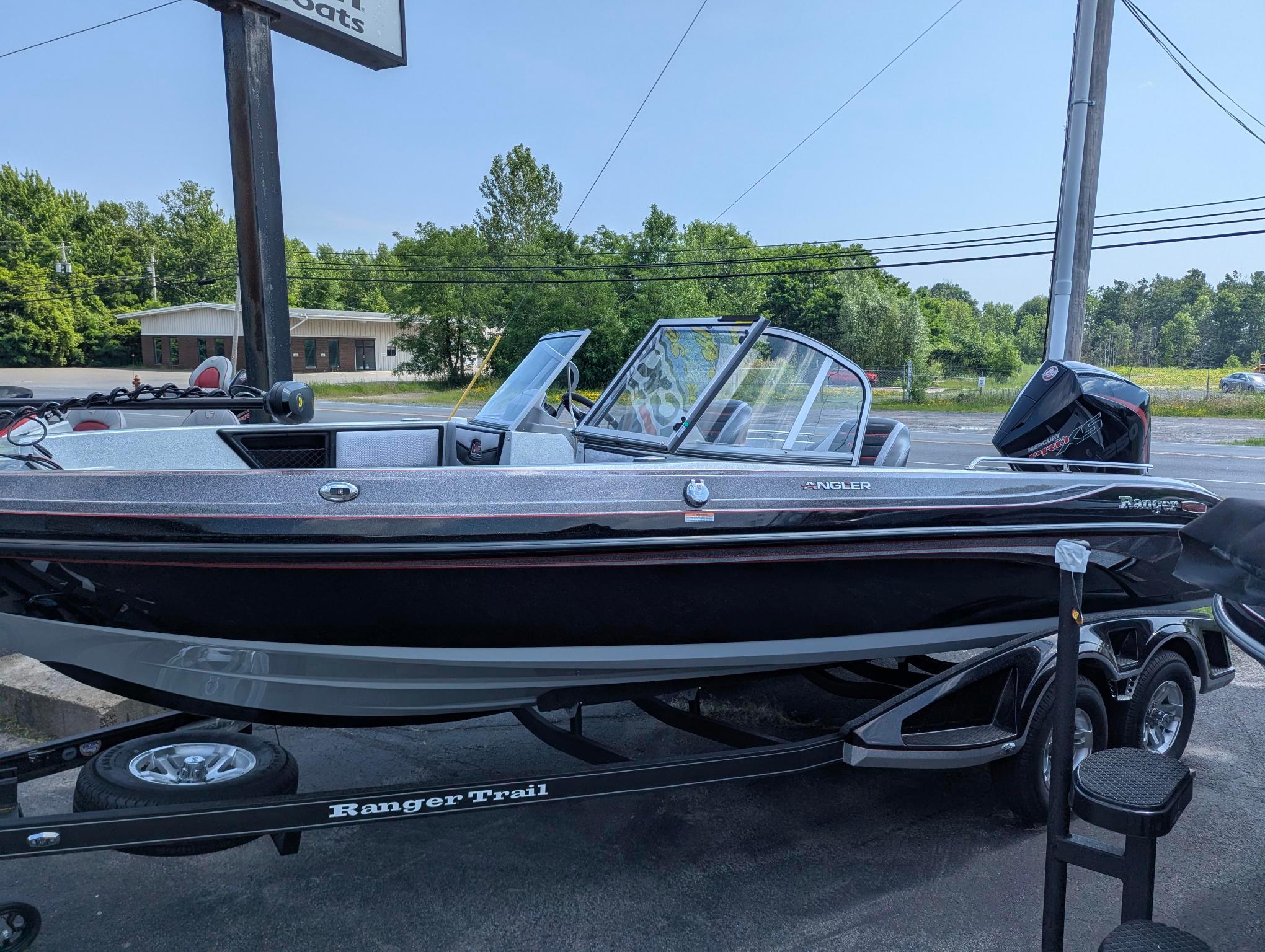 2025 Ranger 2080MS boat on trailer, parked outdoors, showcasing sleek design and modern features.